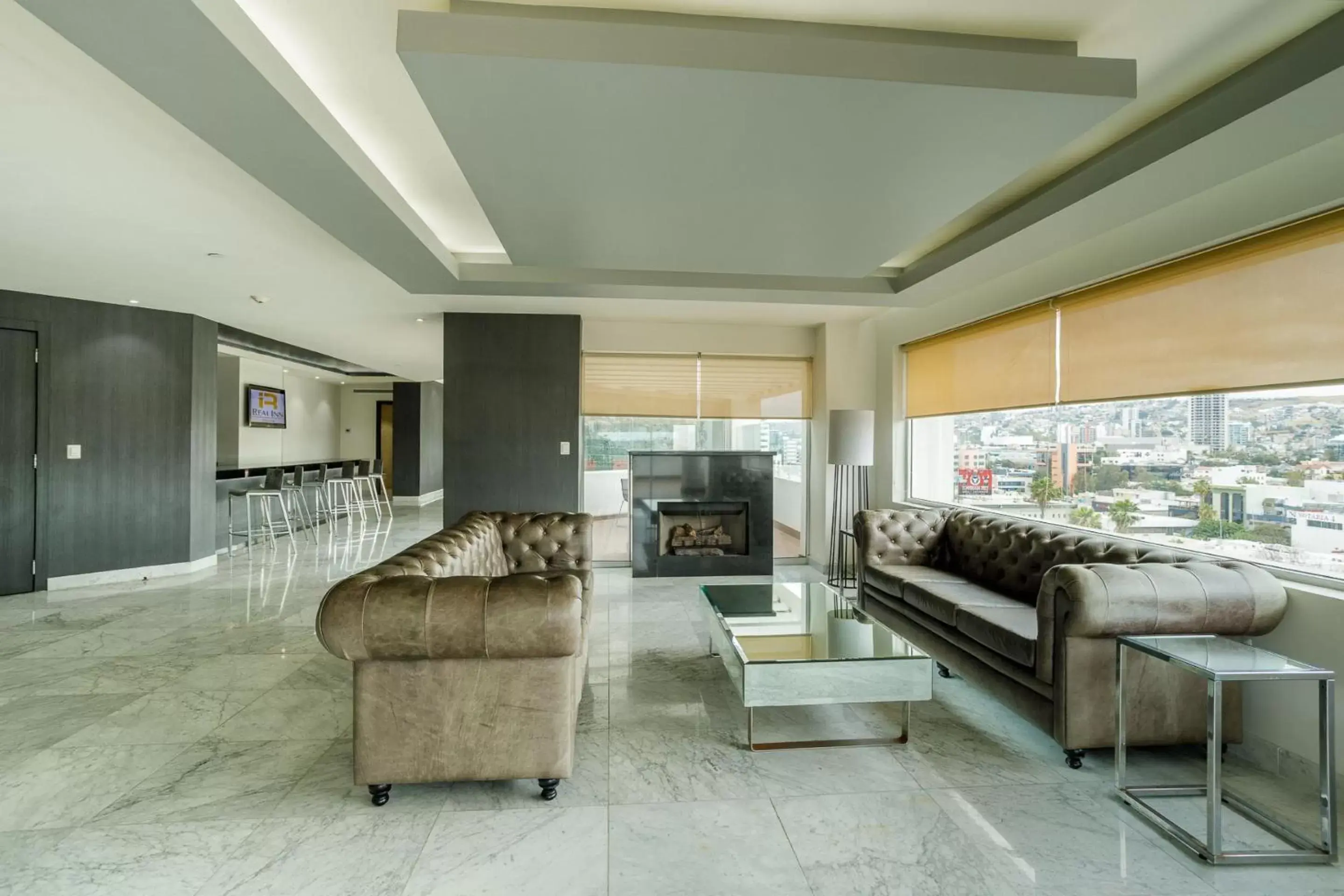 Photo of the whole room, Seating Area in Real Inn Tijuana by Camino Real Hotels