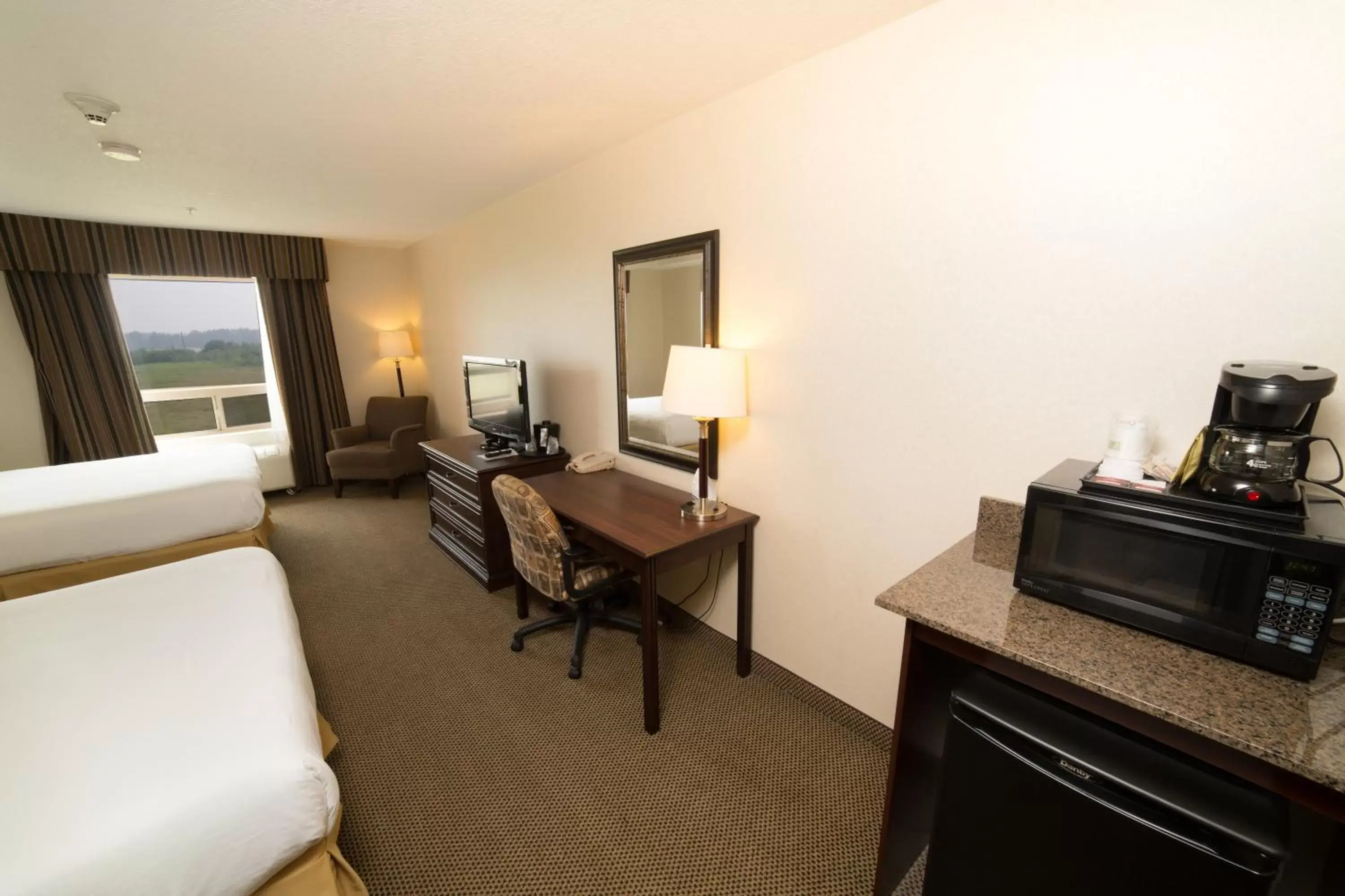 Bedroom, TV/Entertainment Center in Holiday Inn Express Hotel & Suites - Slave Lake, an IHG Hotel
