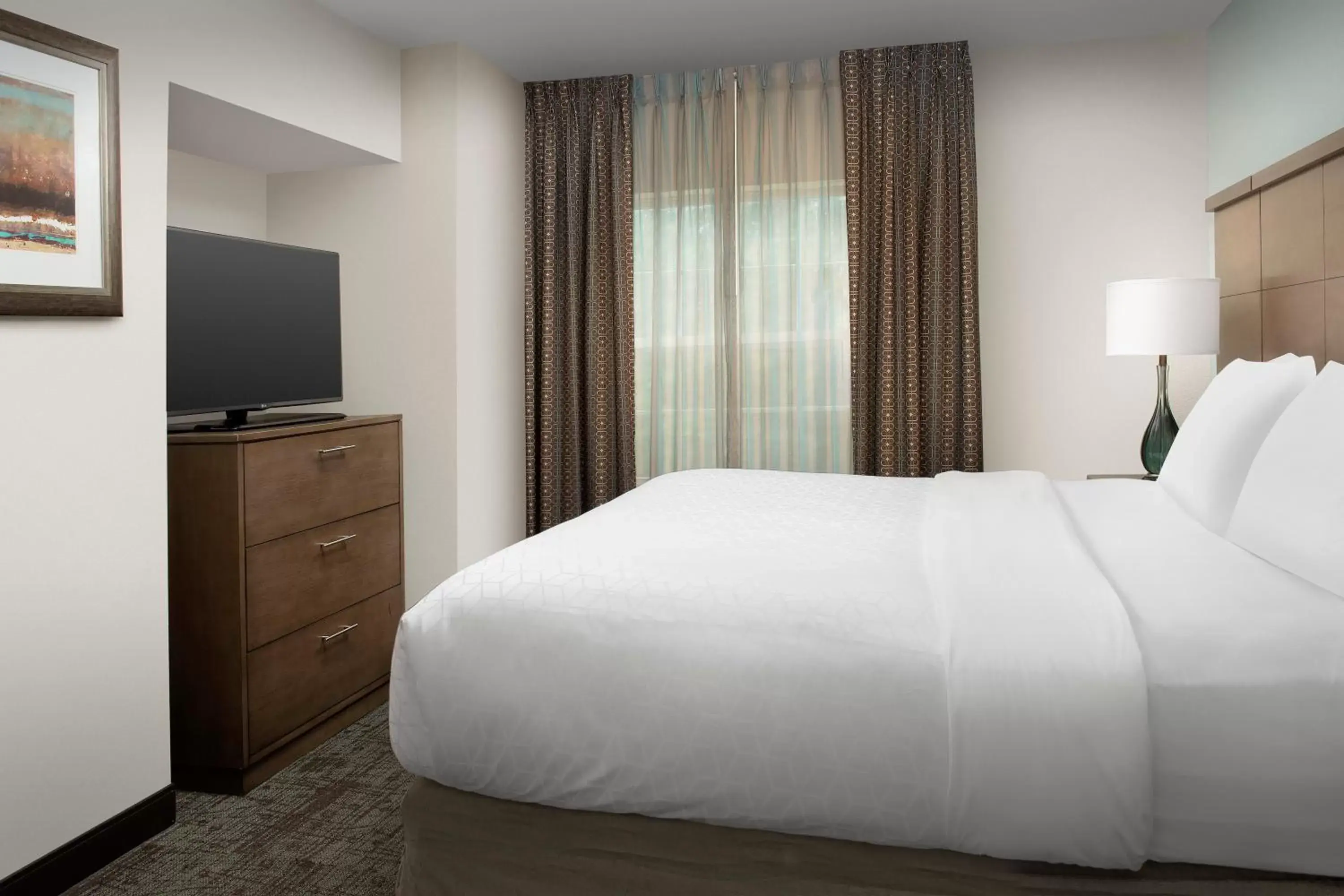 TV and multimedia, Bed in Staybridge Suites Greenville I-85 Woodruff Road, an IHG Hotel