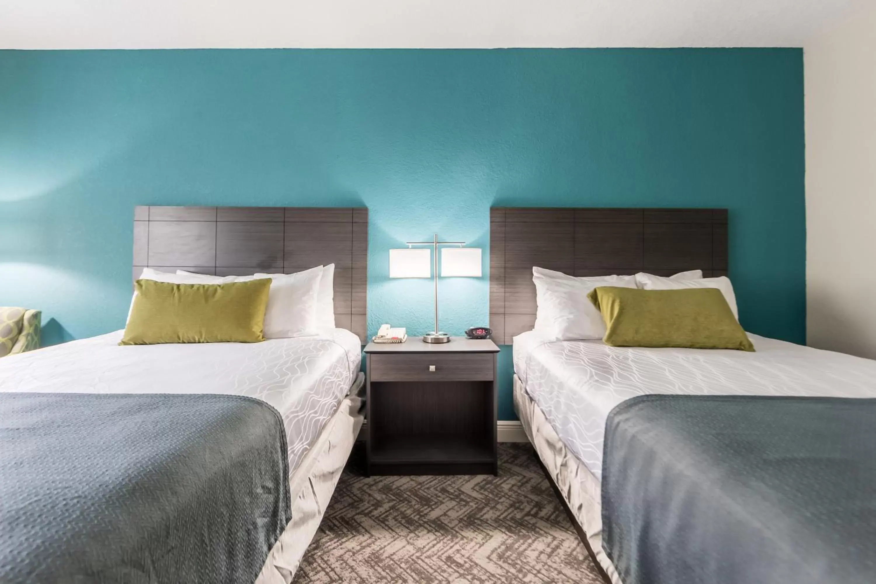 Bed in Best Western Plus Sebastian Hotel & Suites