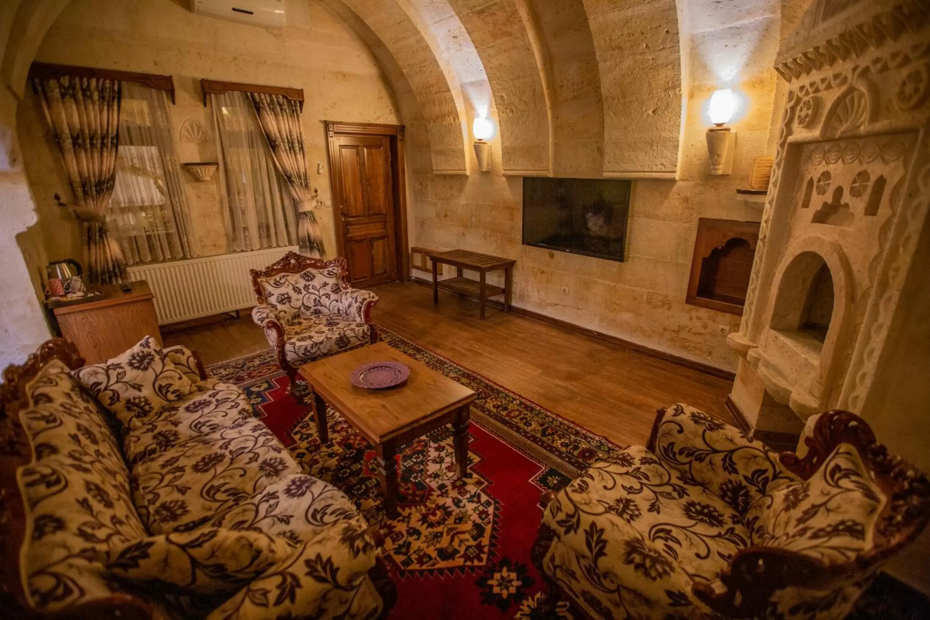 Seating area in Stone House Cave Hotel