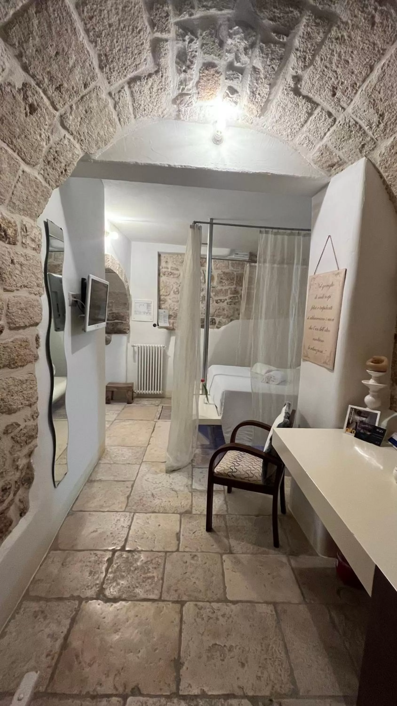 Bed in Antico Mondo Rooms & Suites