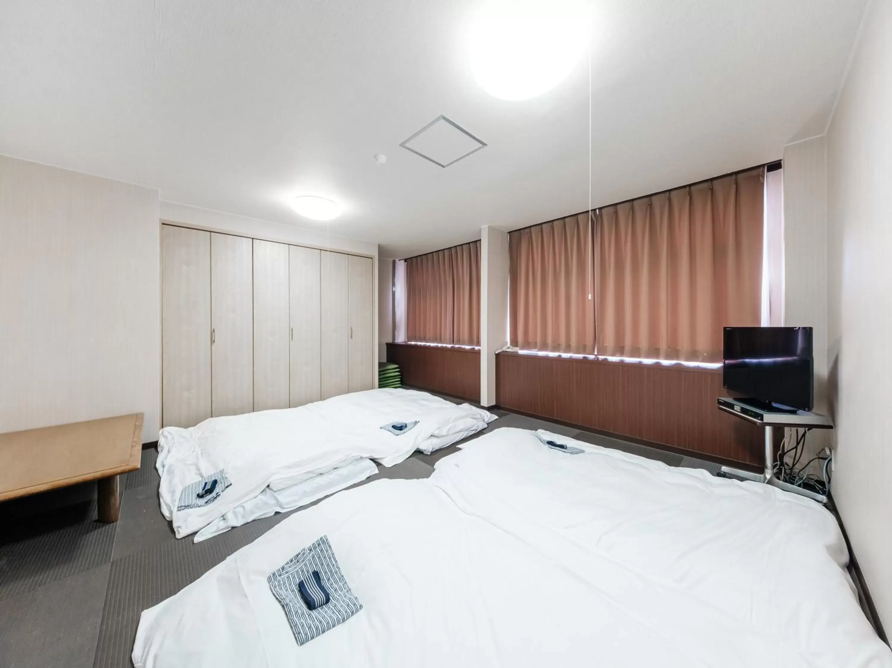 Bed in Tabist Hotel Tetora Hakodate Station