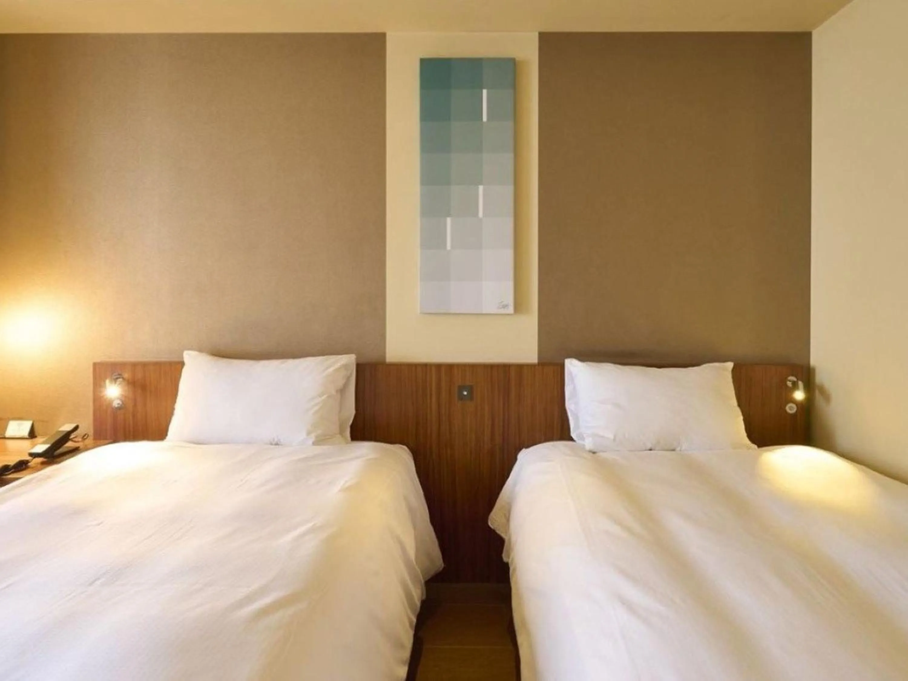 Bed in Hotel Resol Ikebukuro