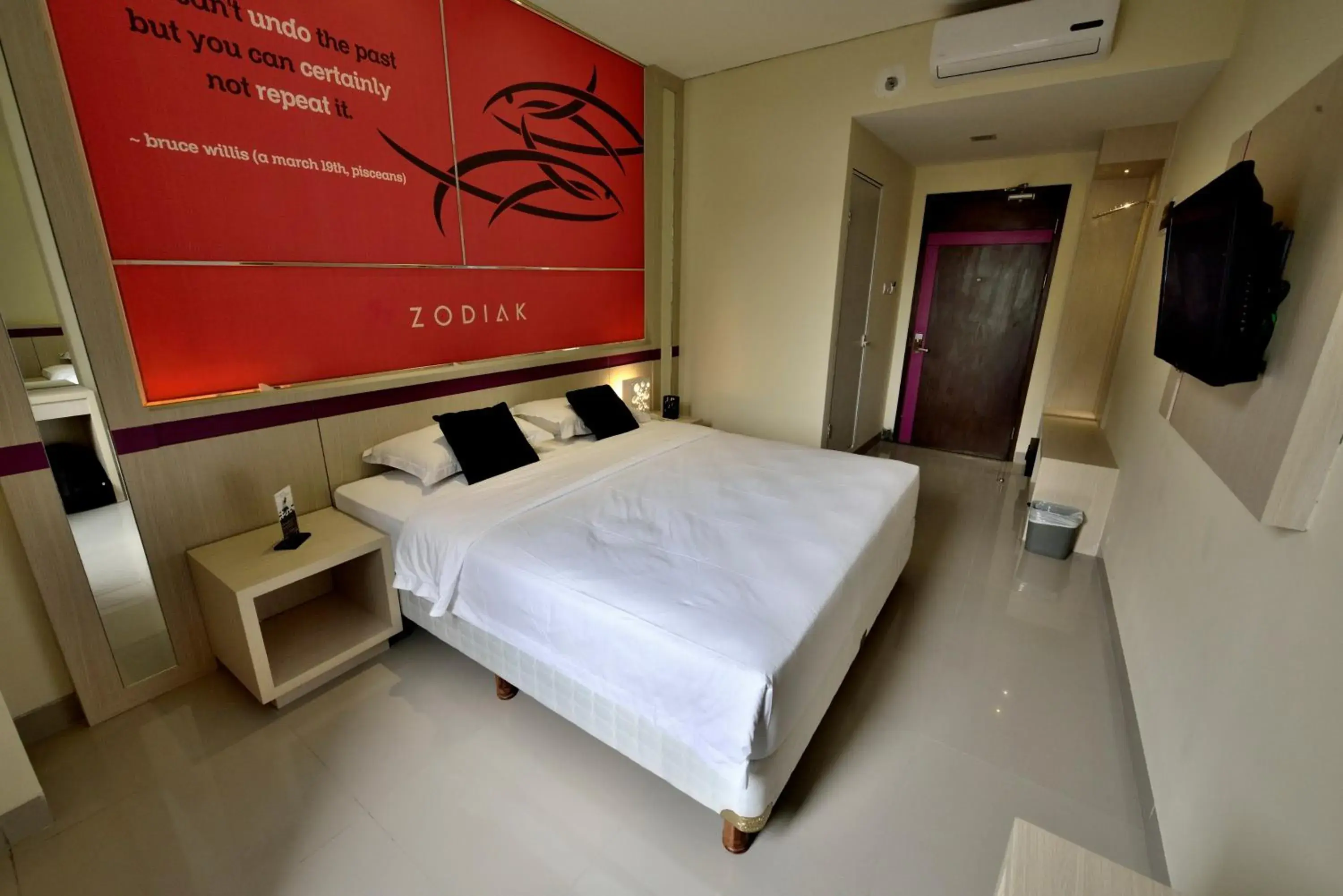 Bed in Zodiak Kebon Kawung by KAGUM Hotels