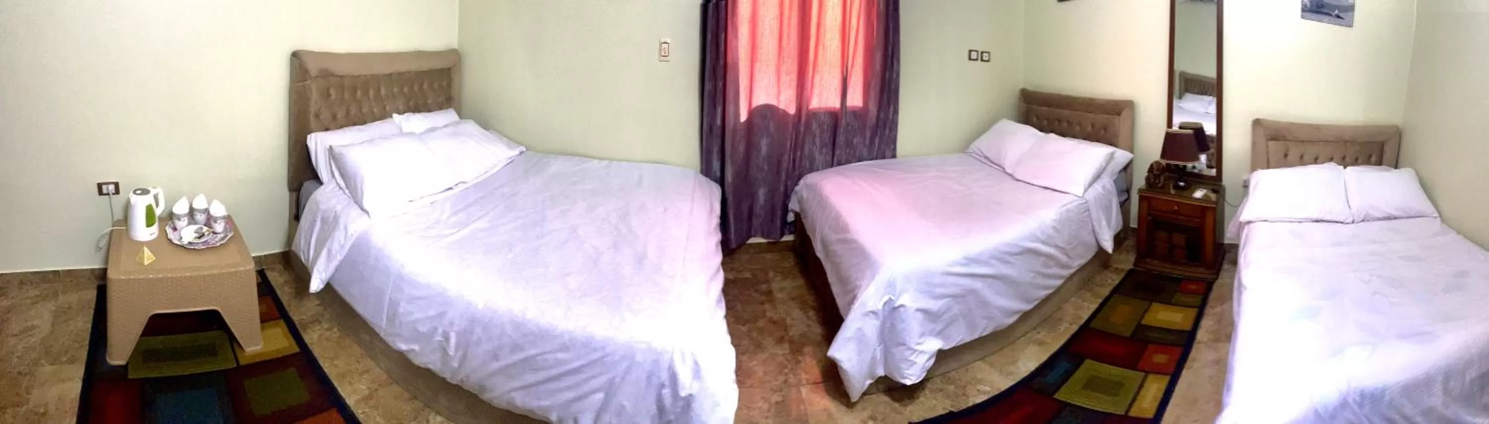 Bed in Sphinx palace pyramids view