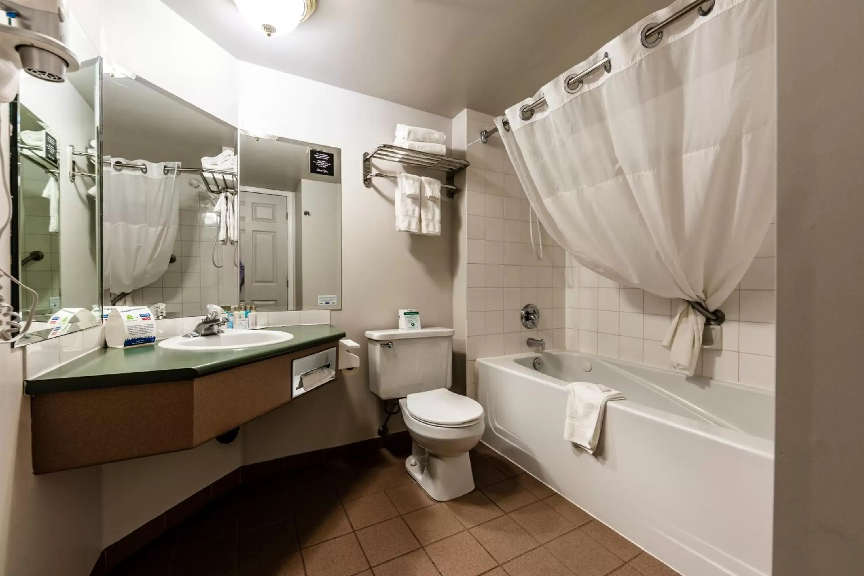 Toilet, Bathroom in Travelodge by Wyndham Parksville