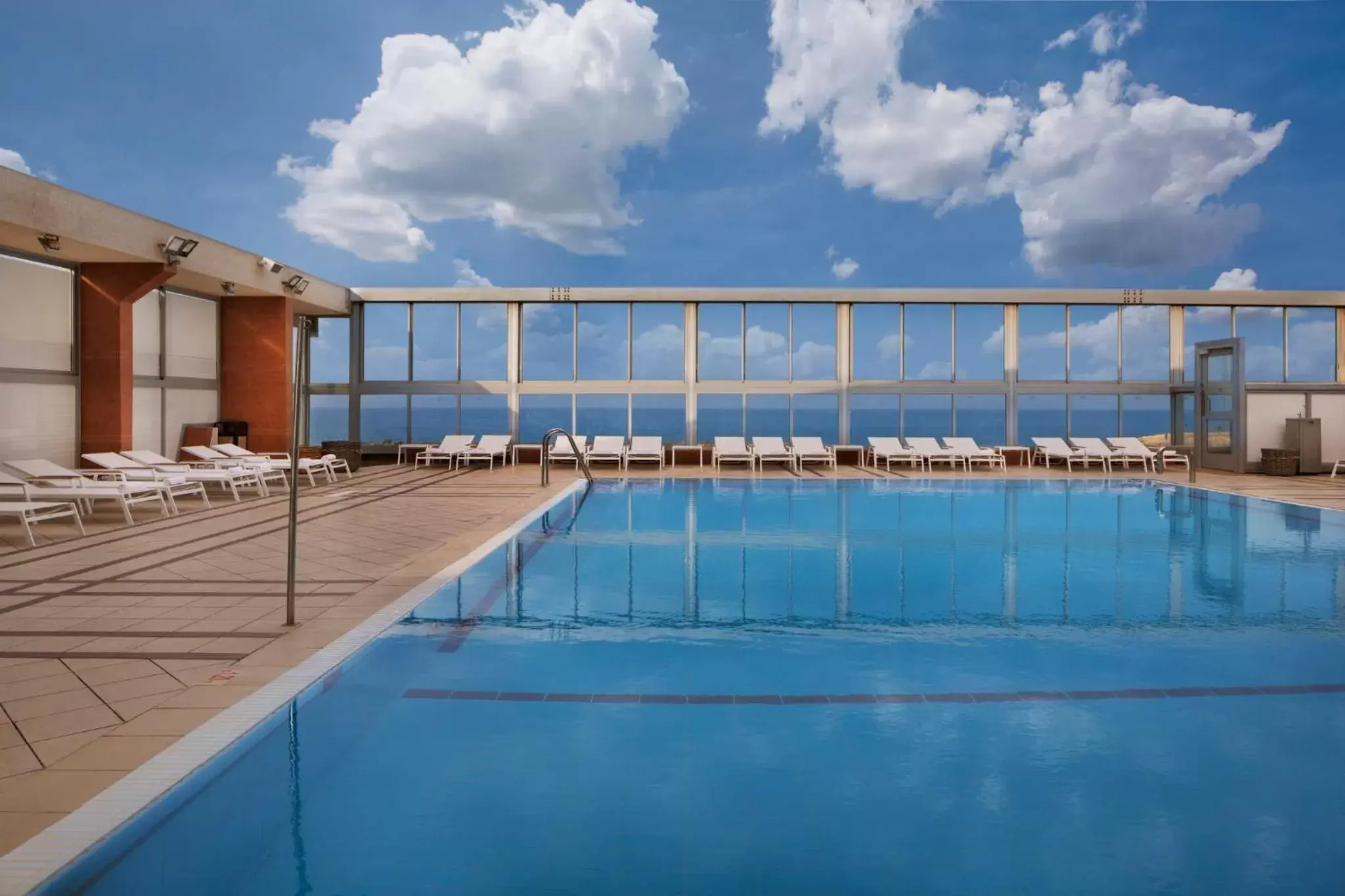 Swimming Pool in Crowne Plaza Tel Aviv Beach, an IHG Hotel