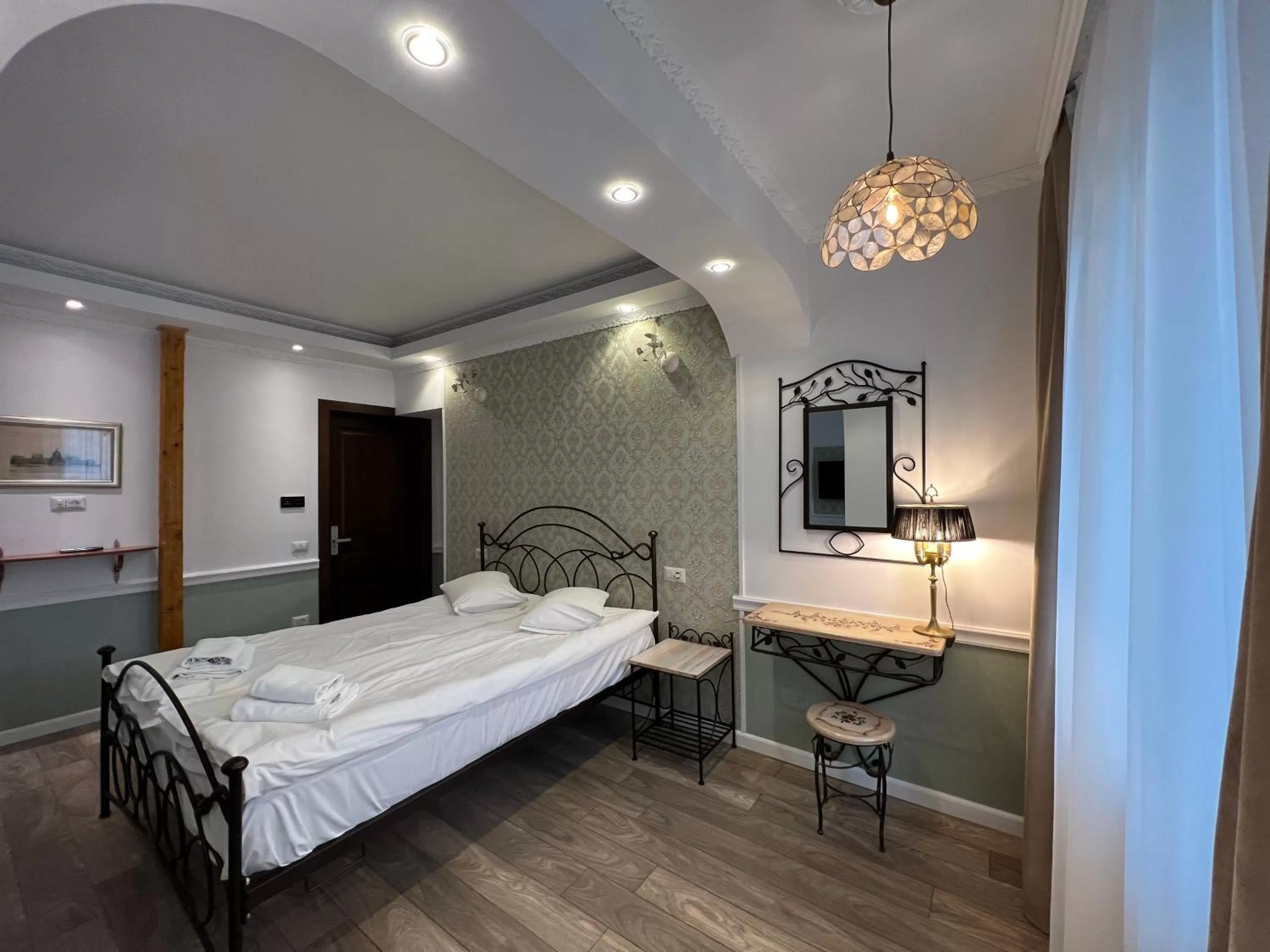 Bed in Hotel Boutique Cathedral Plaza Residences room for rent downtown