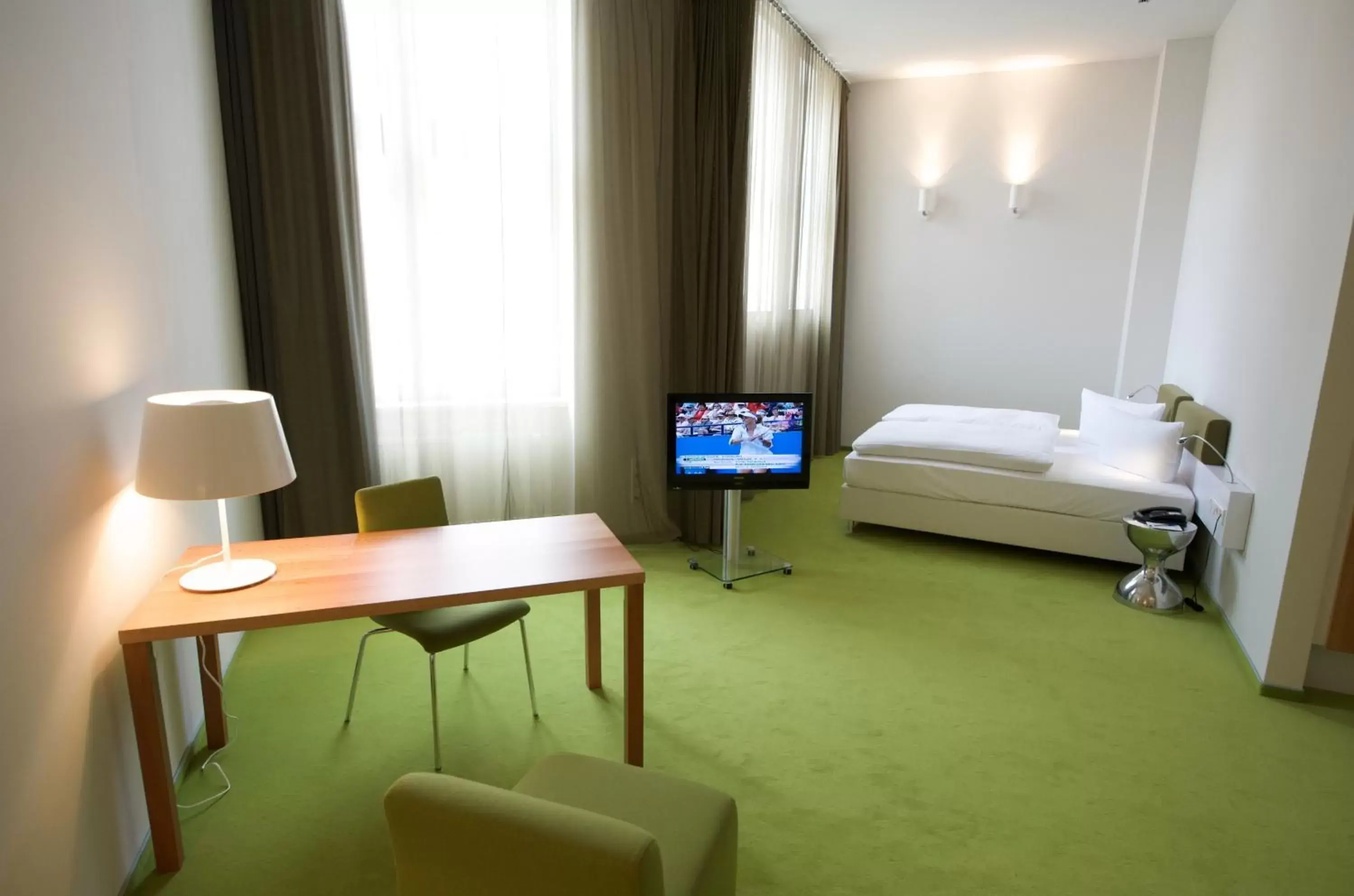 Photo of the whole room, TV/Entertainment Center in Wyndham Garden Berlin Mitte
