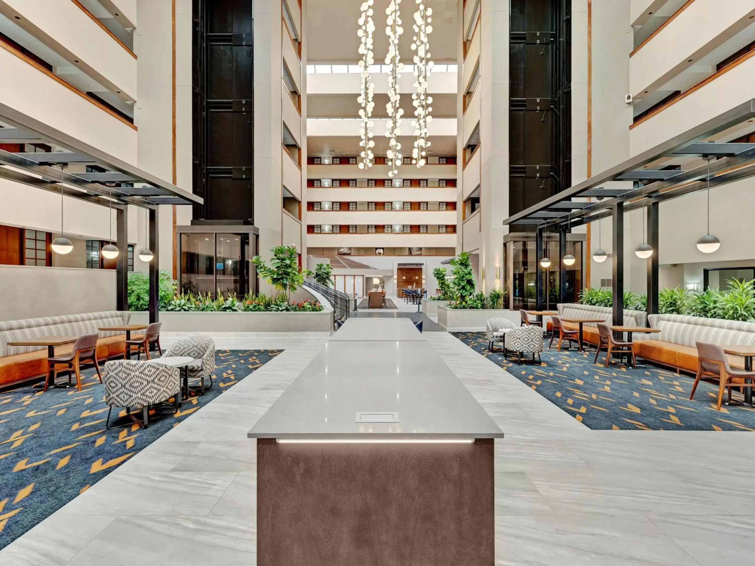 Lobby or reception in Embassy Suites by Hilton Oklahoma City Will Rogers Airport Lobby or reception in Embassy Suites by Hilton Oklahoma City Will Rogers Airport