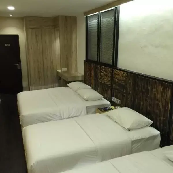 Bed in The Oikos Hotel Bed in The Oikos Hotel