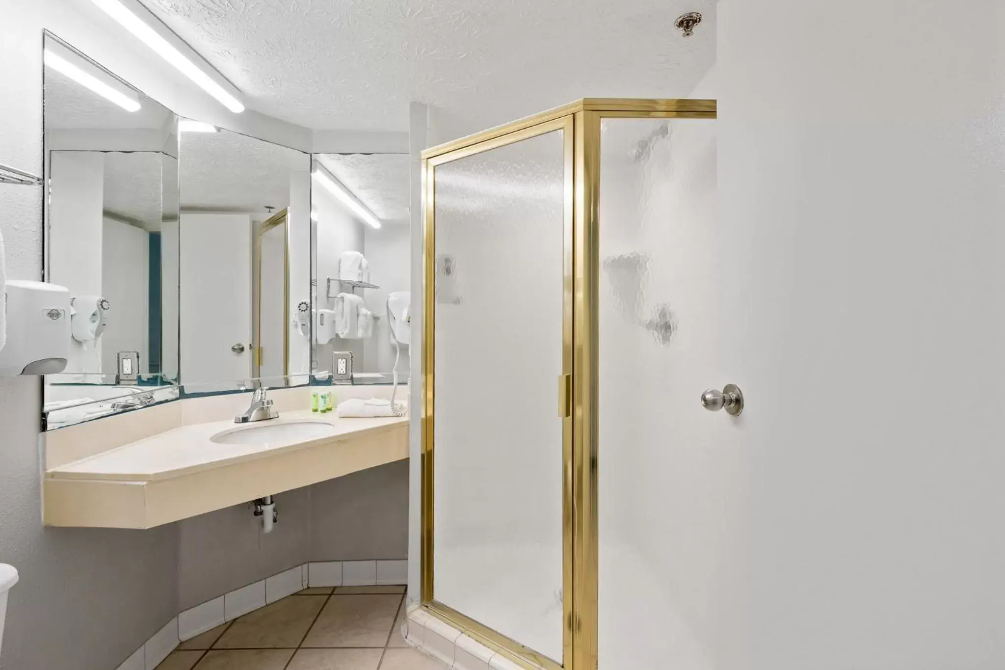 Bathroom in Beachcomber Beachfront Hotel, a By The Sea Resort