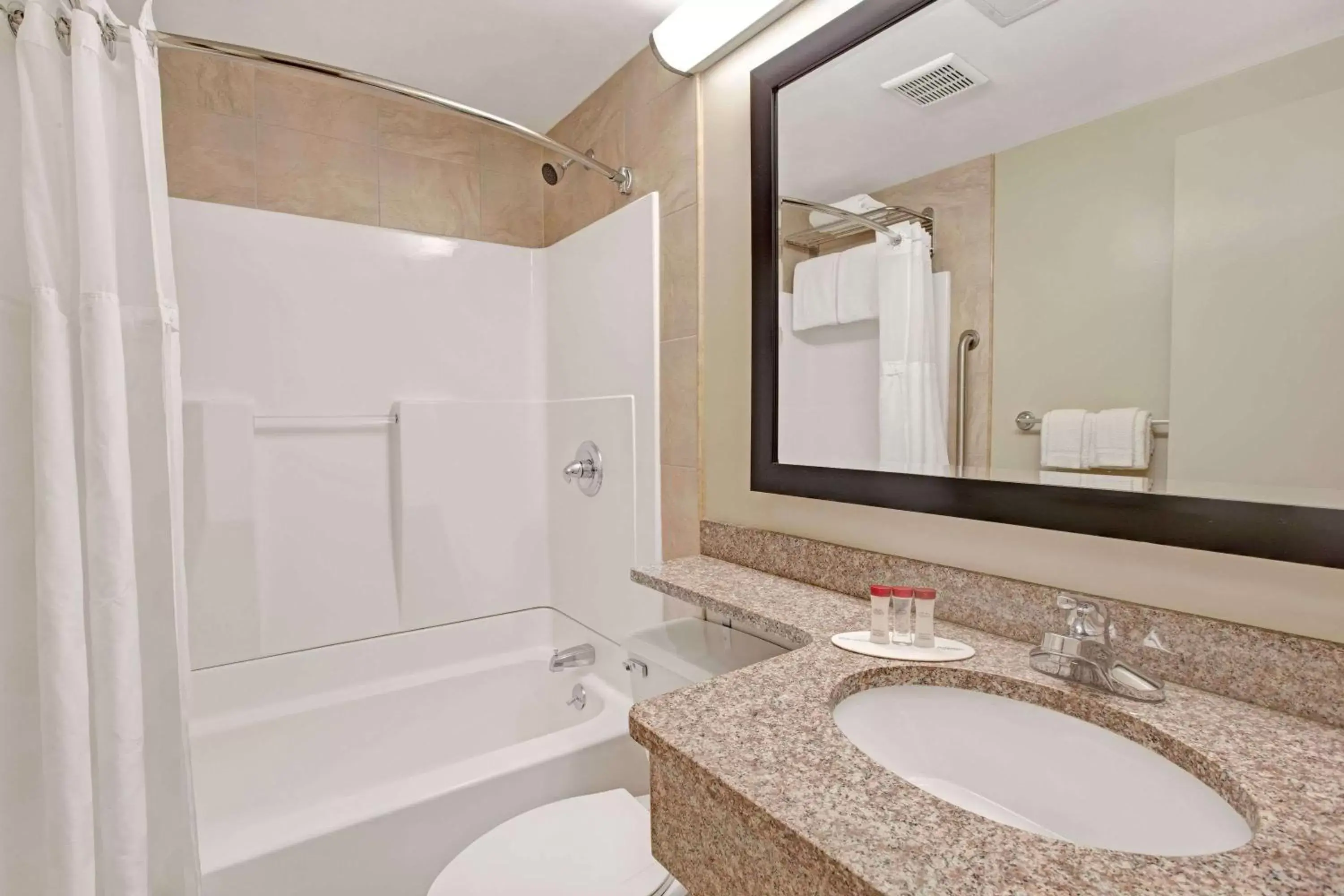 Bathroom in Ramada by Wyndham Staten Island