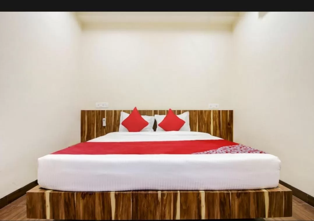 Bed in Hotel Nisarg Lodging And Restaurant