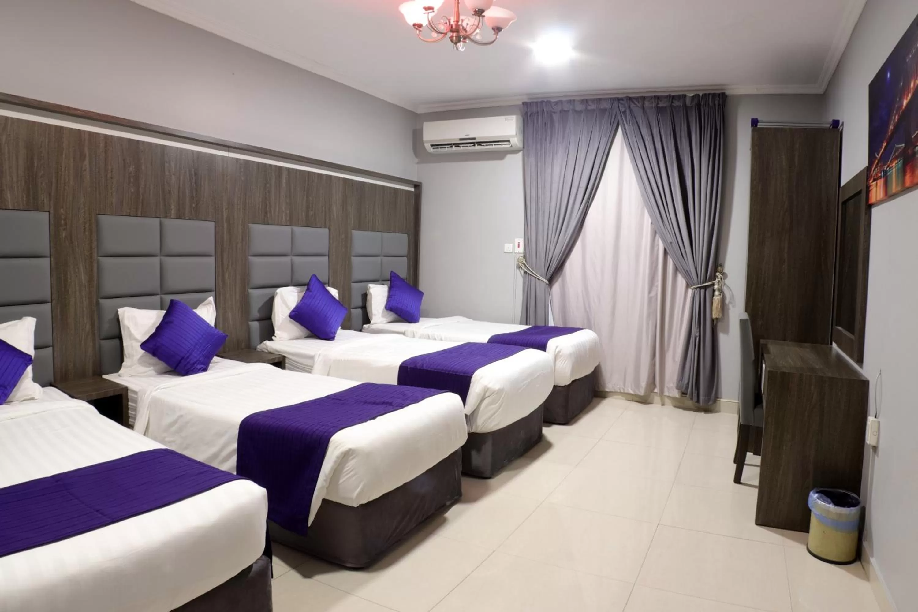 Bed in Maskan Al Dyafah Hotel Apartments
