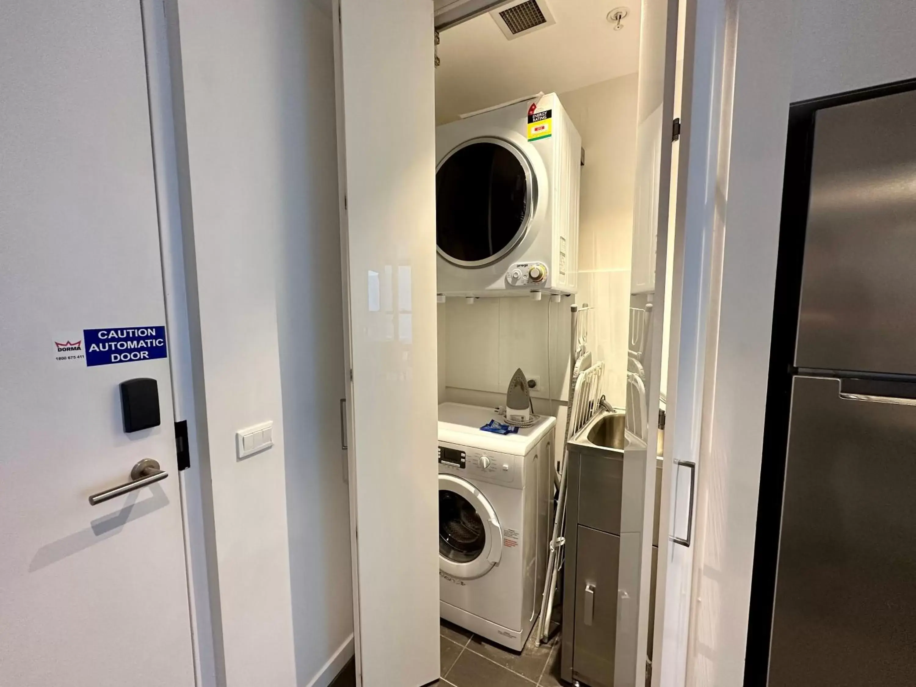 washing machine, Bathroom in Brisbane Skytower by CLLIX