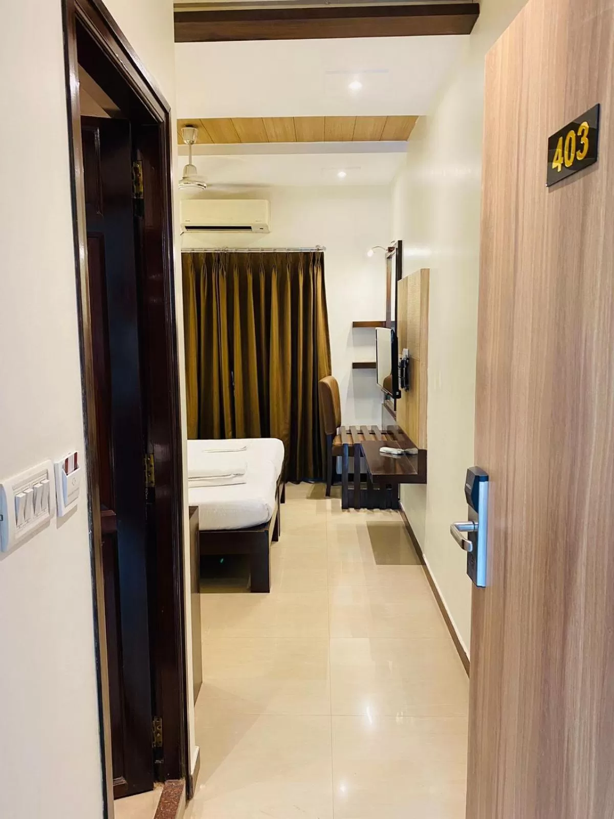 TV and multimedia, Bed in Hotel Plaza Heights by RAK Rooms, Mangaluru
