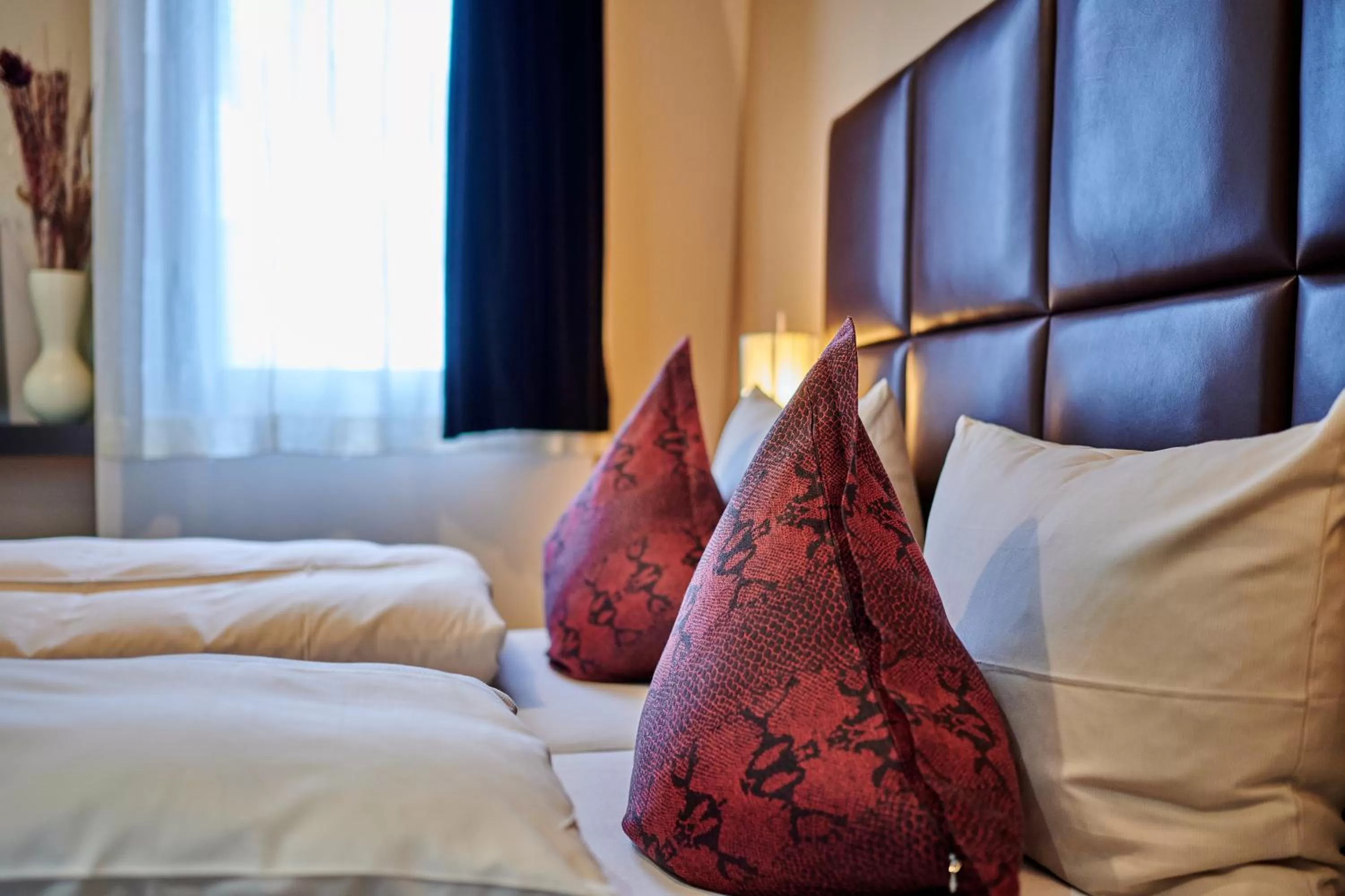 Bed in Genusshotel Wenisch