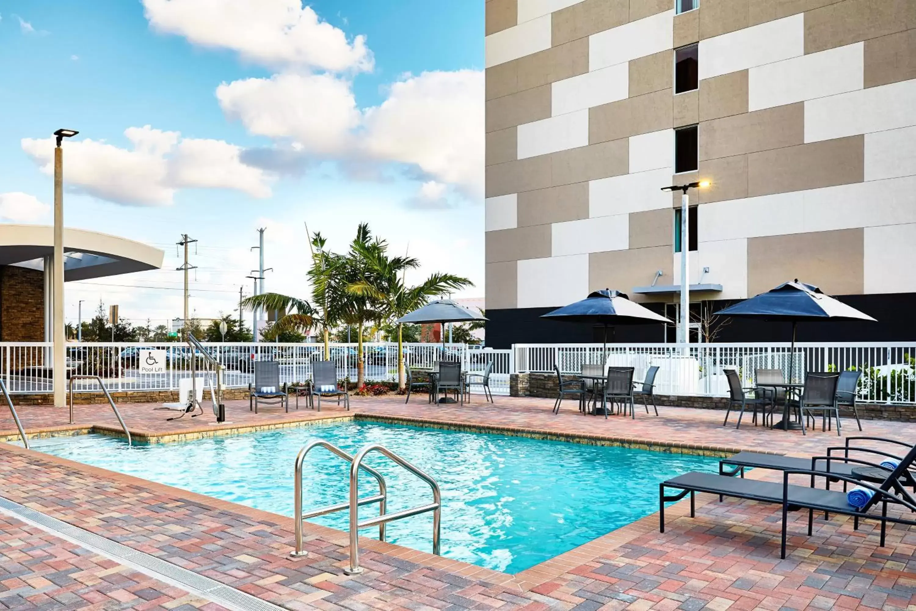 Swimming Pool in AC Hotel by Marriott Miami Airport West/Doral