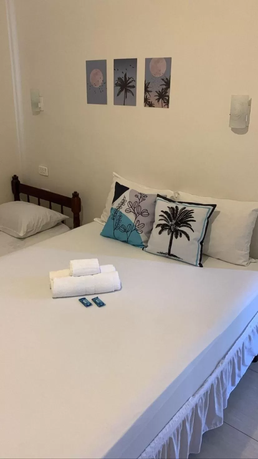 Bed in Pousada Recanto Som do Mar