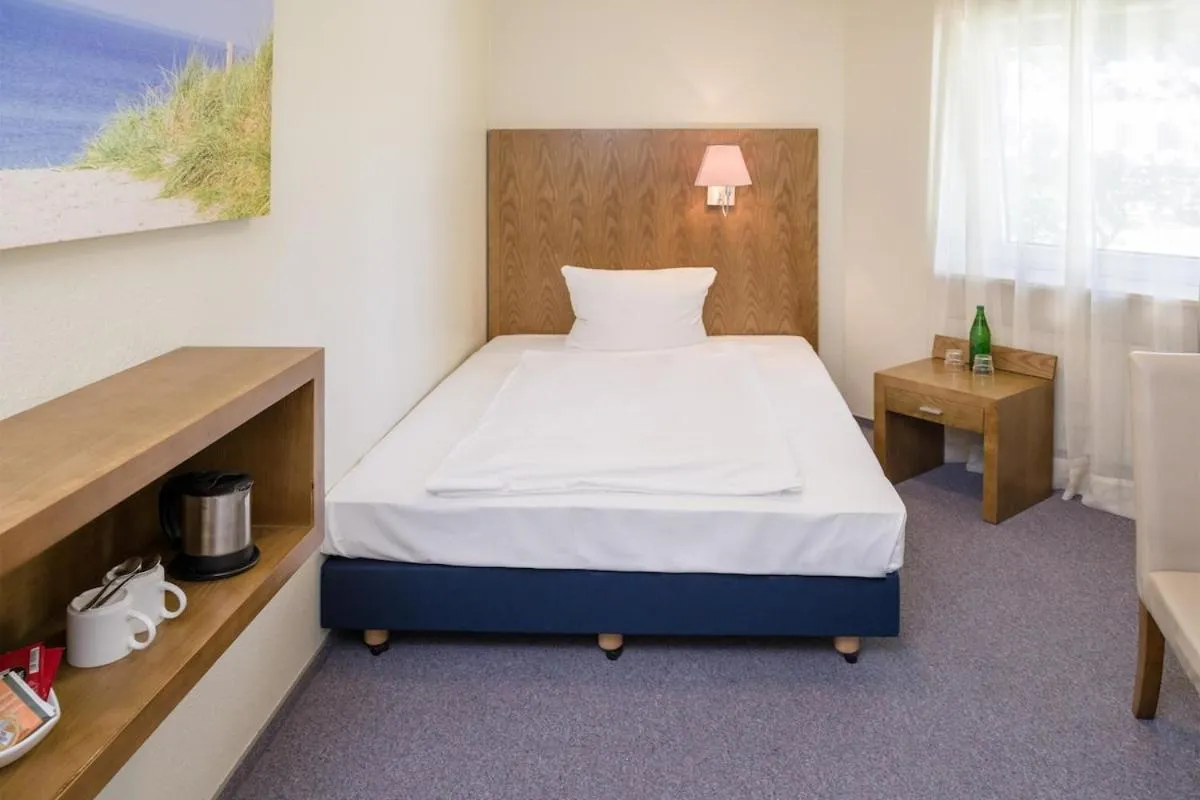 Bed in Hotel Königstein Kiel by Tulip Inn