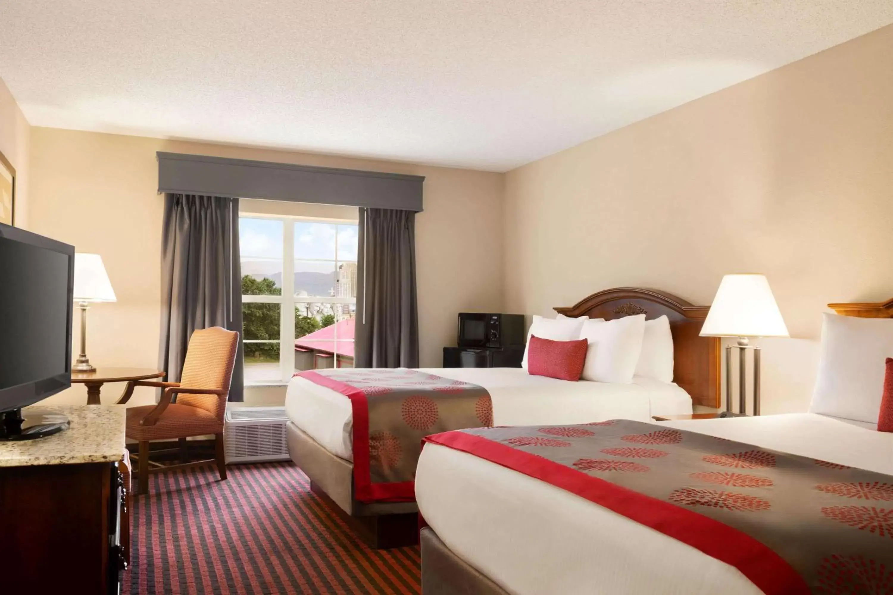 Photo of the whole room, Bed in Ramada by Wyndham Pigeon Forge North
