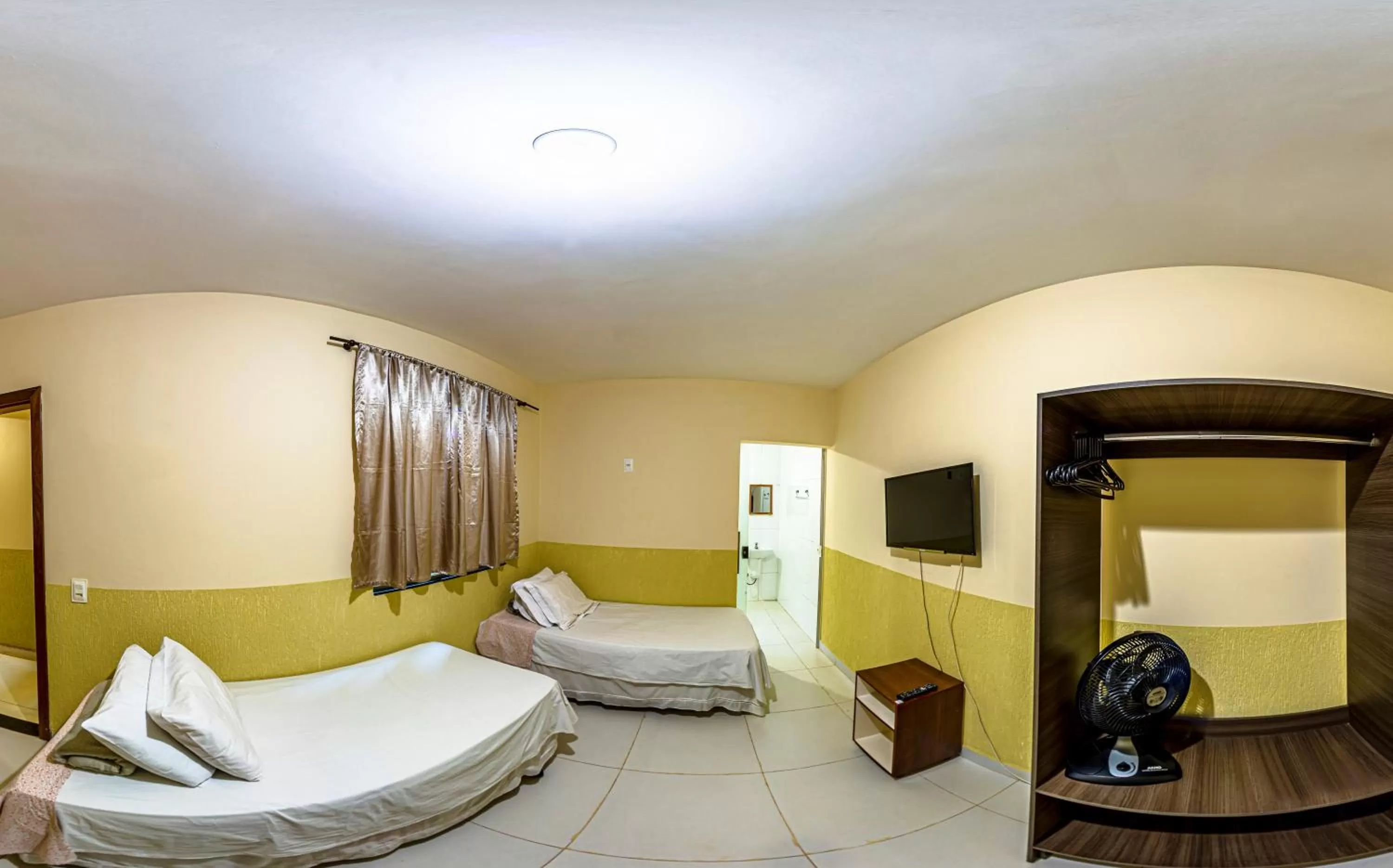 Bed in Pousada Jardim Brasília