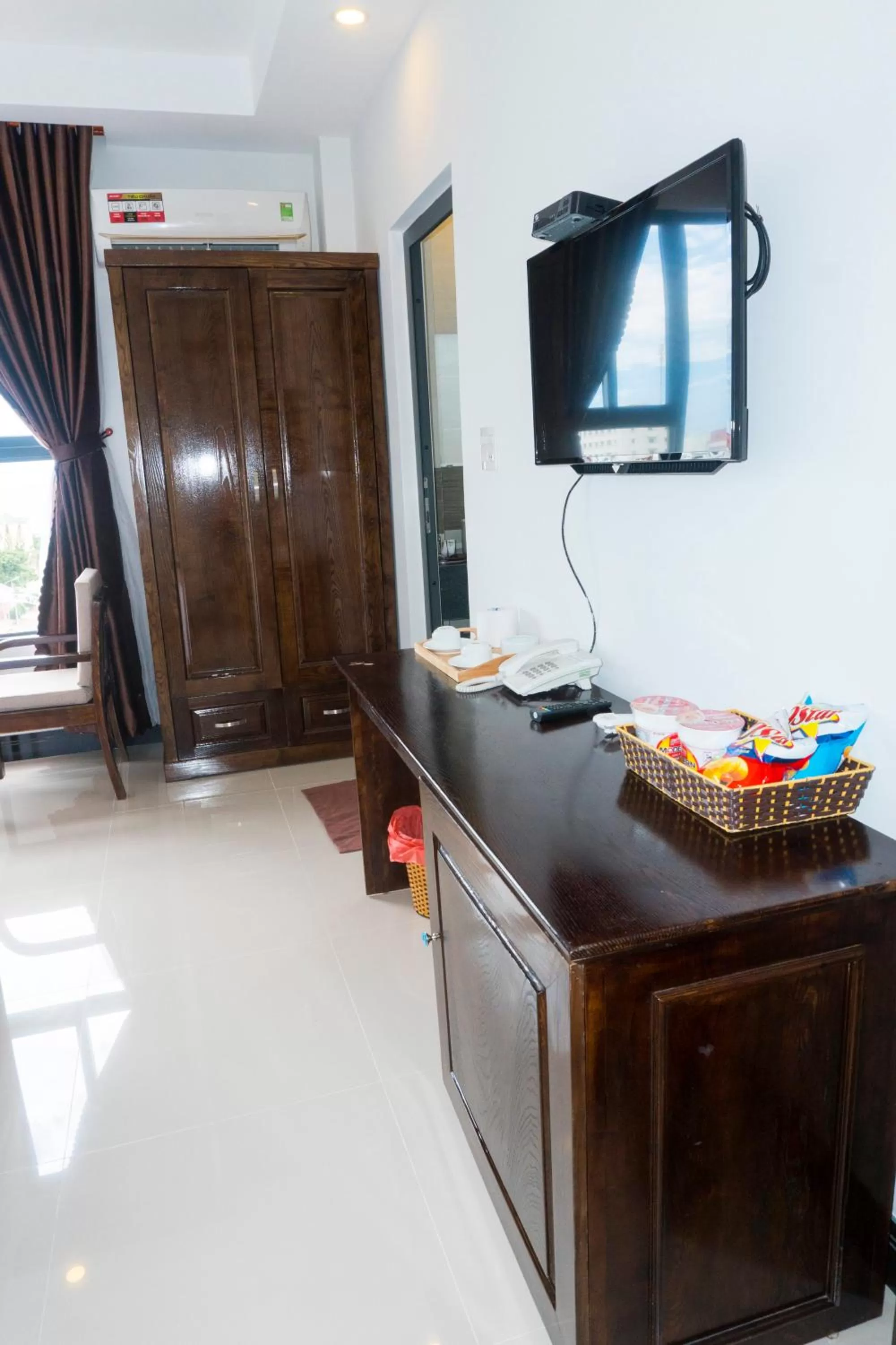 TV/Entertainment Center in Aries Hotel