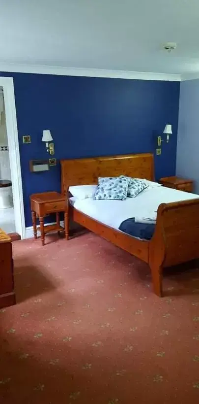 Bed in Donington Manor Hotel