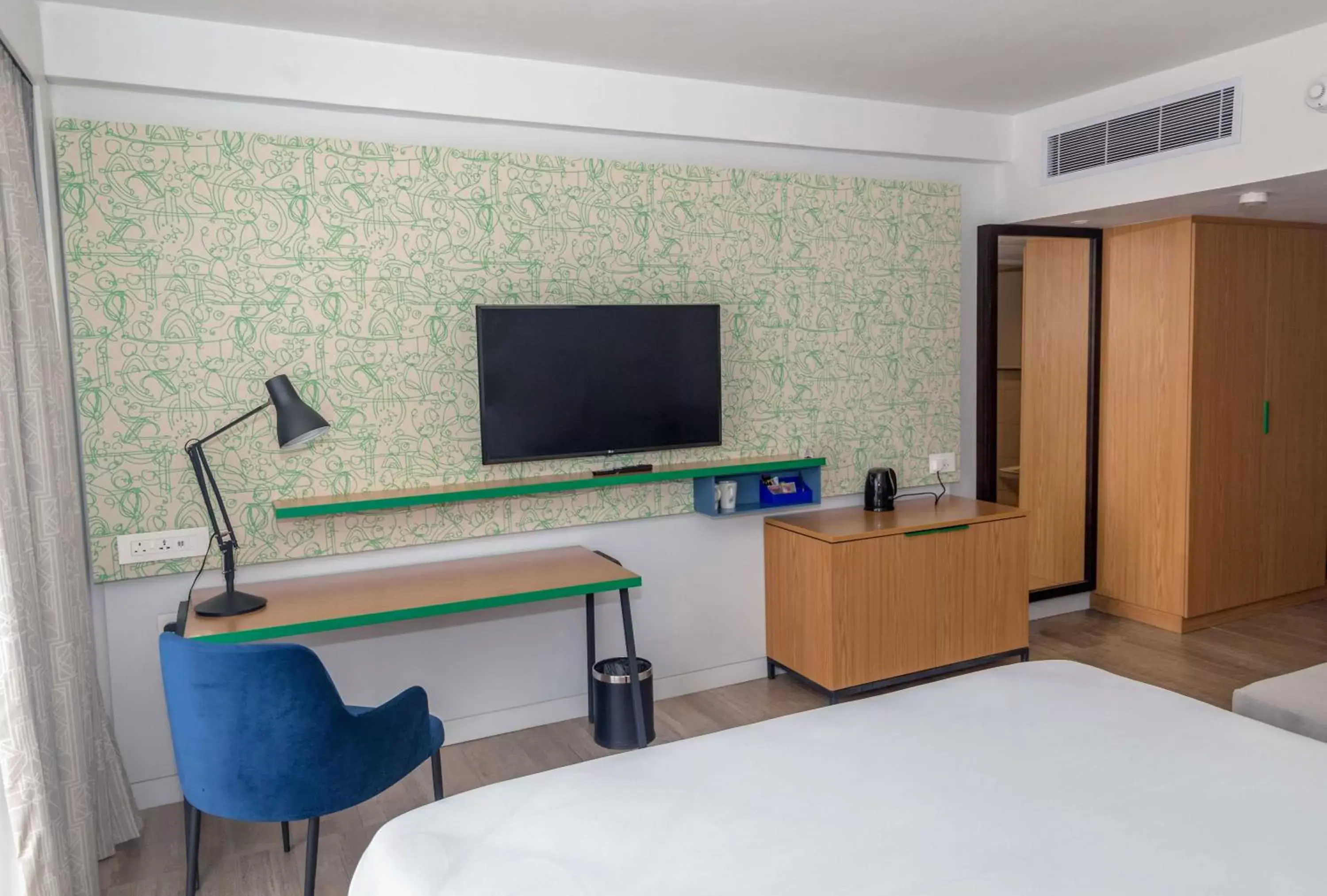 Photo of the whole room, TV/Entertainment Center in Holiday Inn - Lusaka, an IHG Hotel