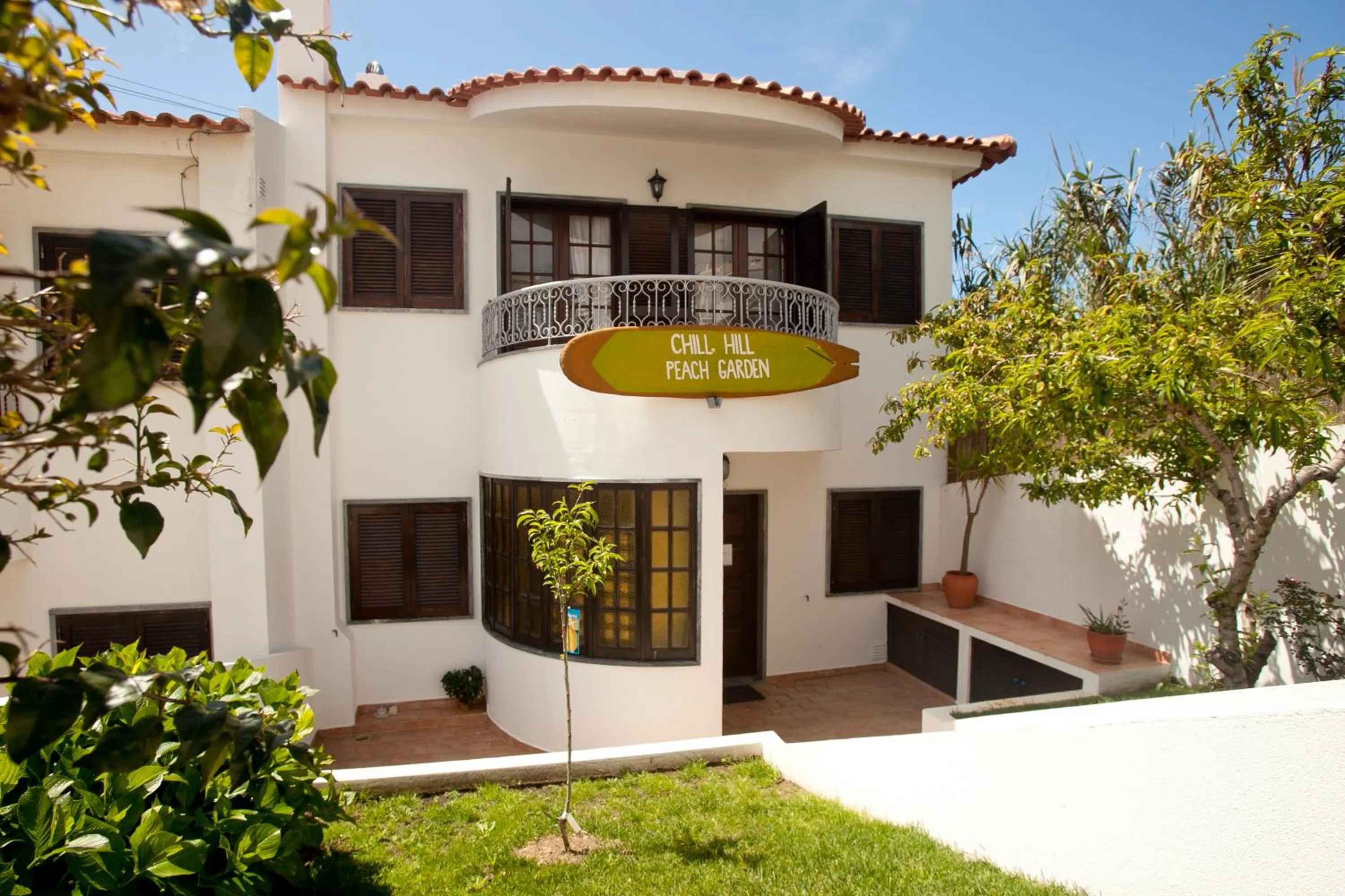 Property logo or sign in Ericeira Chill Hill Hostel & Private Rooms - Peach Garden