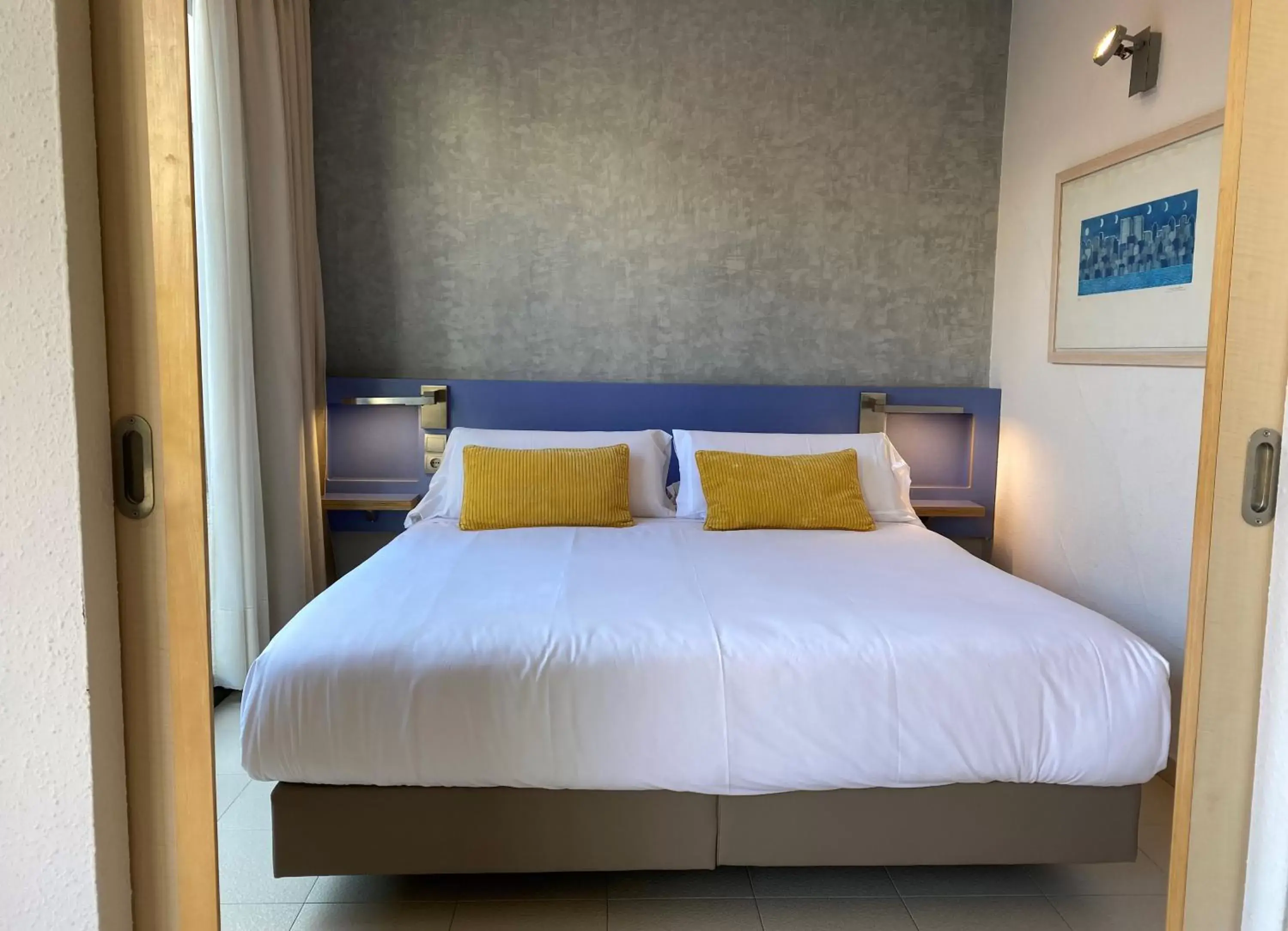 Bed in Atenea Park Suites & Apartments