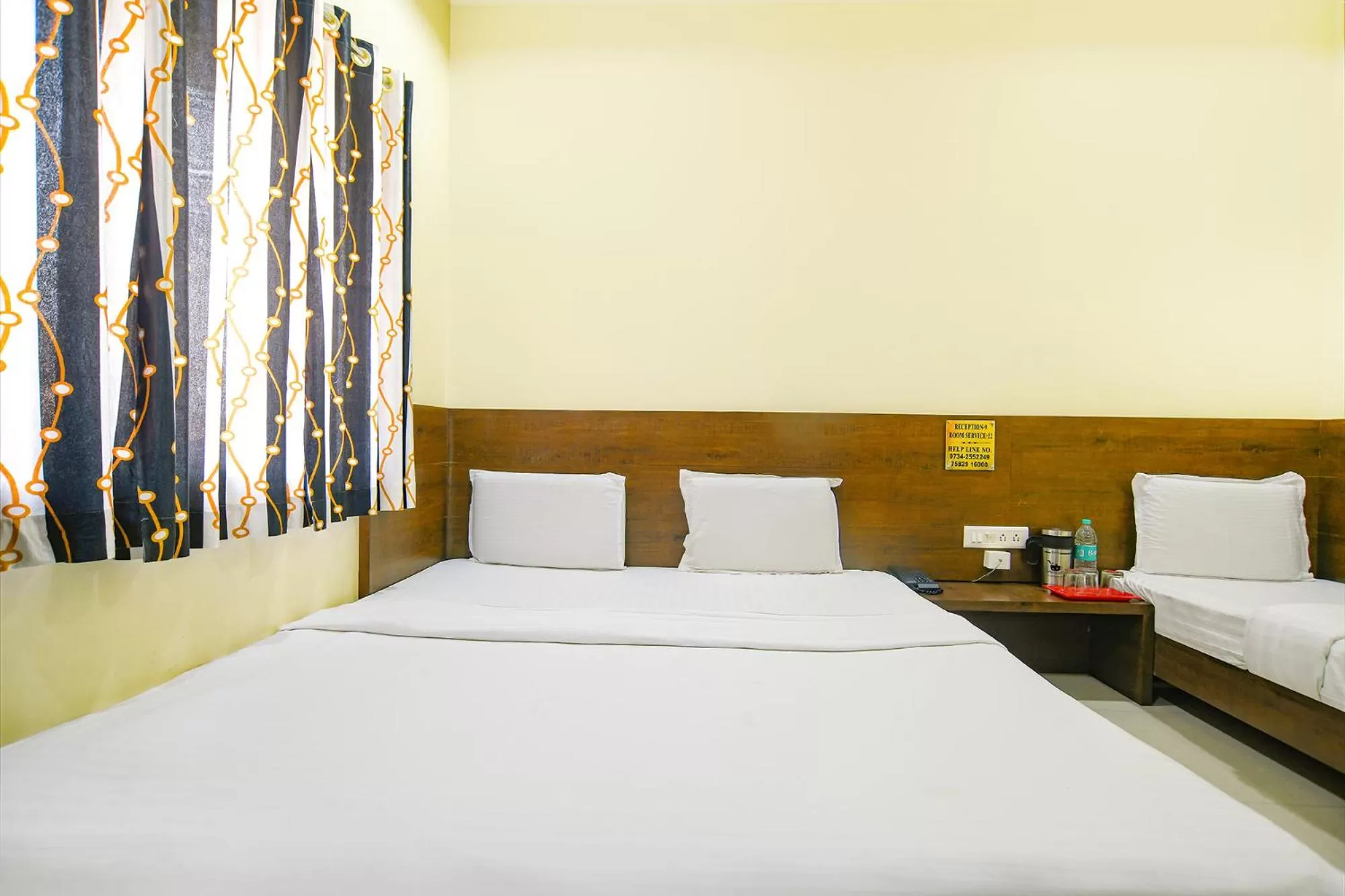 Bed in FabHotel Satyug Jaisinghpura