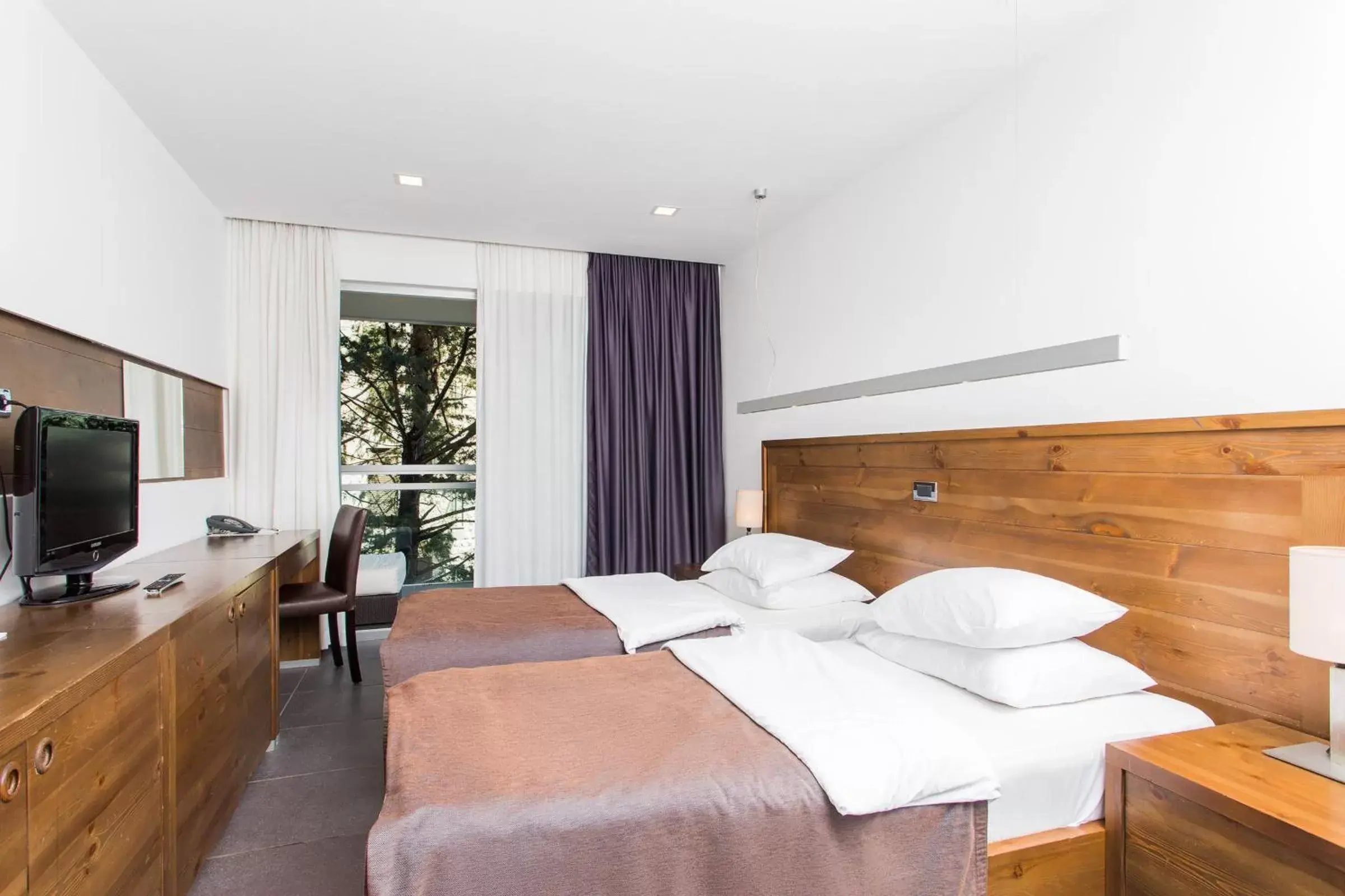Bed in Avala Resort & Villas