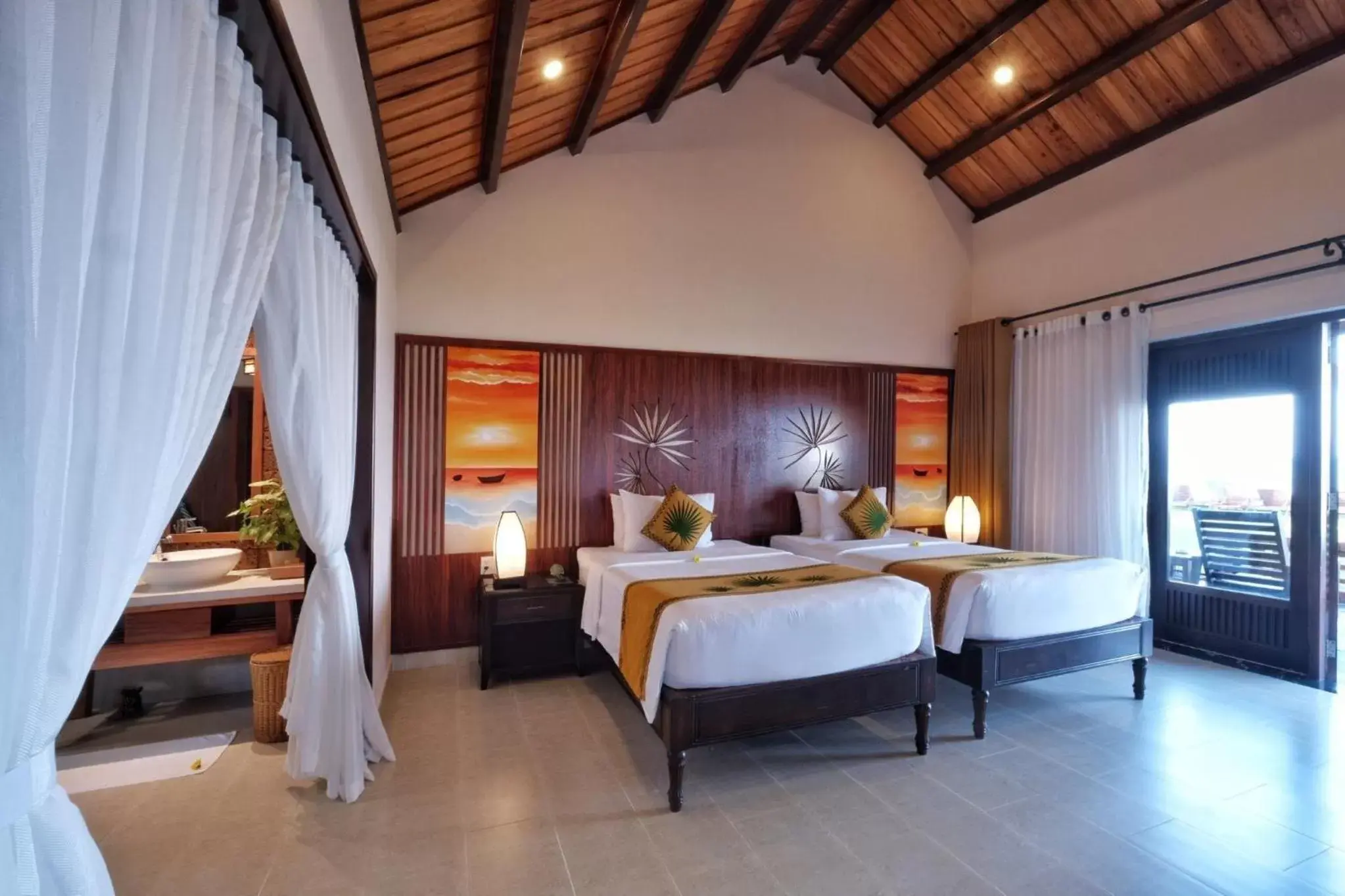 Bed in Palm Garden Beach Resort & Spa