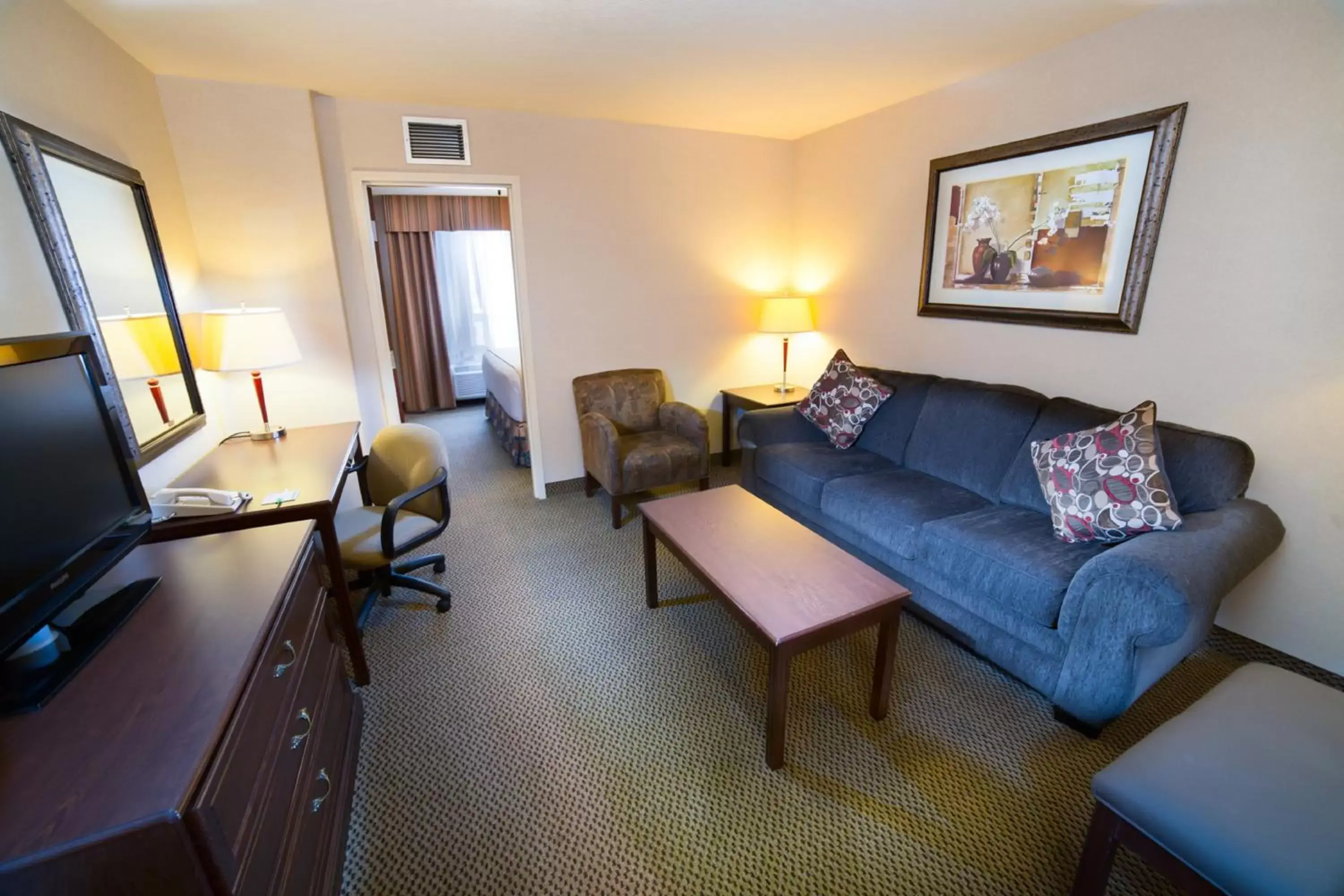 Bedroom, Seating Area in Holiday Inn Hotel & Suites-West Edmonton, an IHG Hotel