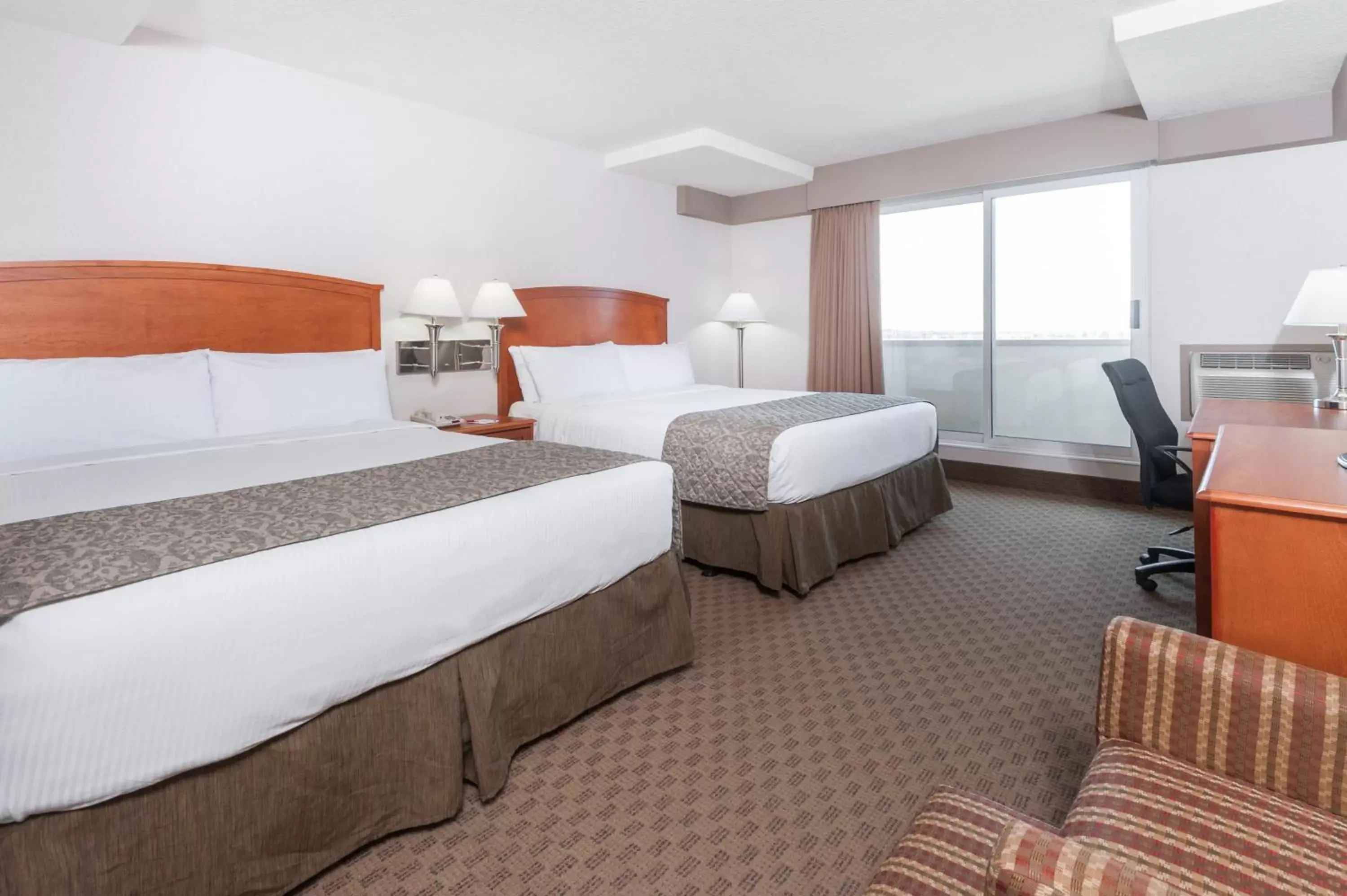 Photo of the whole room, Bed in Ramada by Wyndham Edmonton South