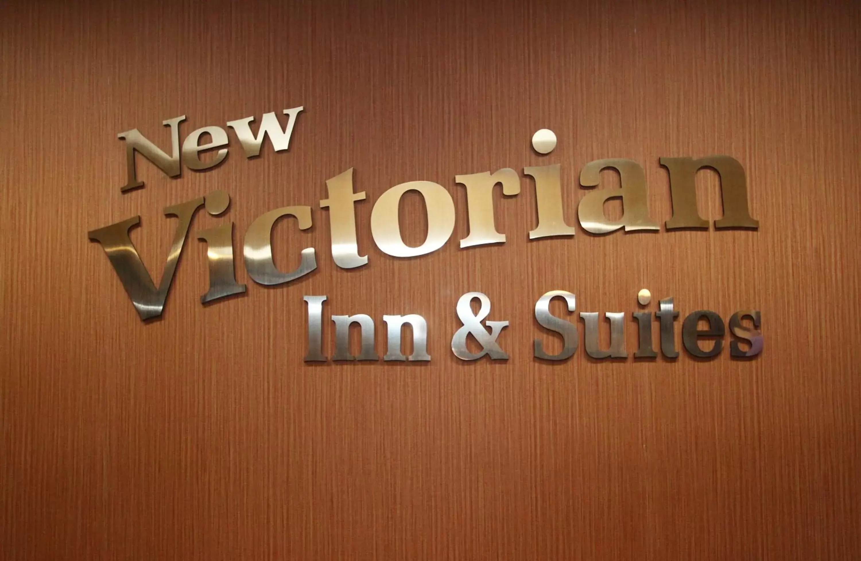 Property logo or sign in New Victorian Inn & Suites Lincoln