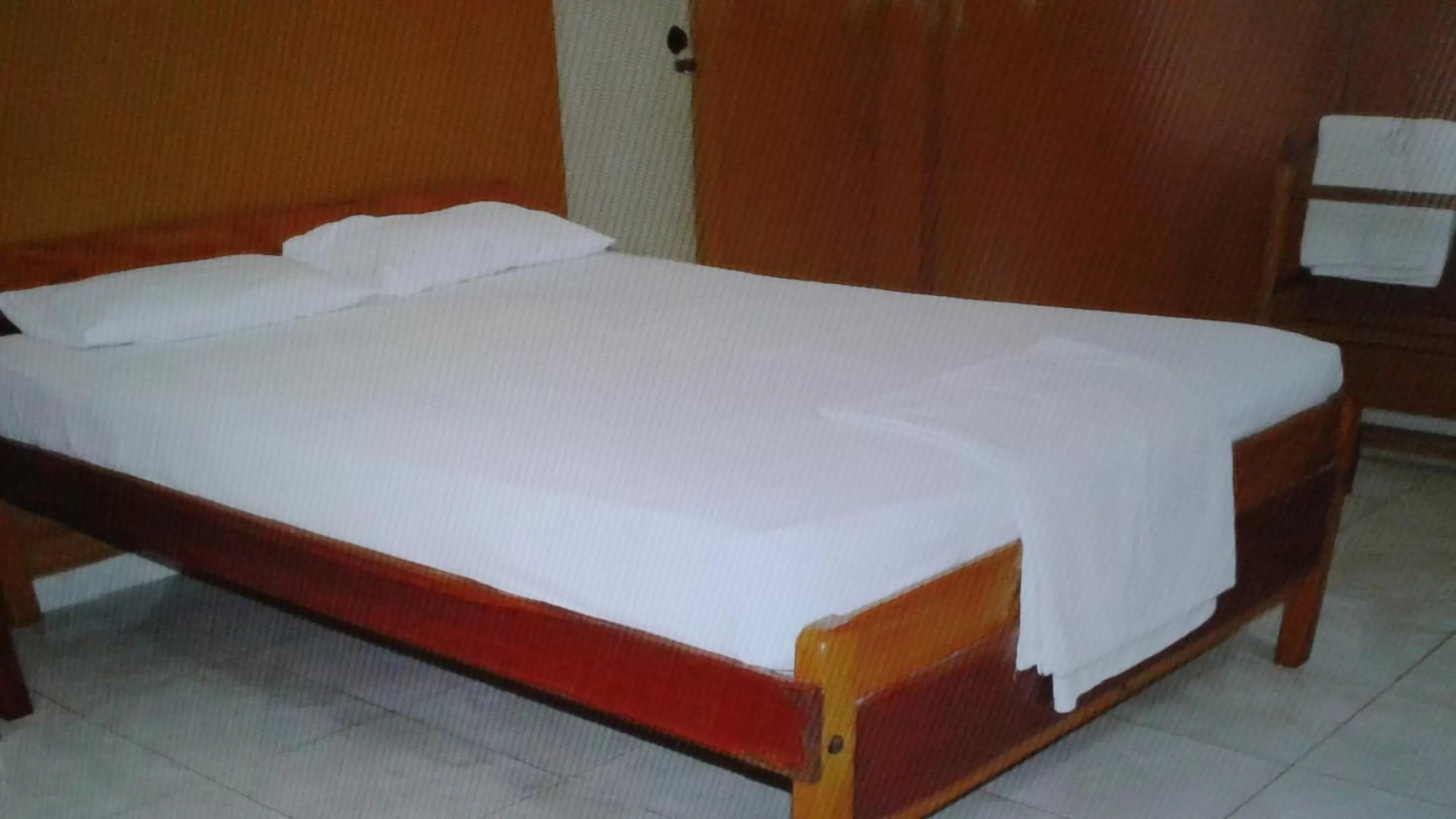 Bed in Gnaanams Hotel and Restaurant