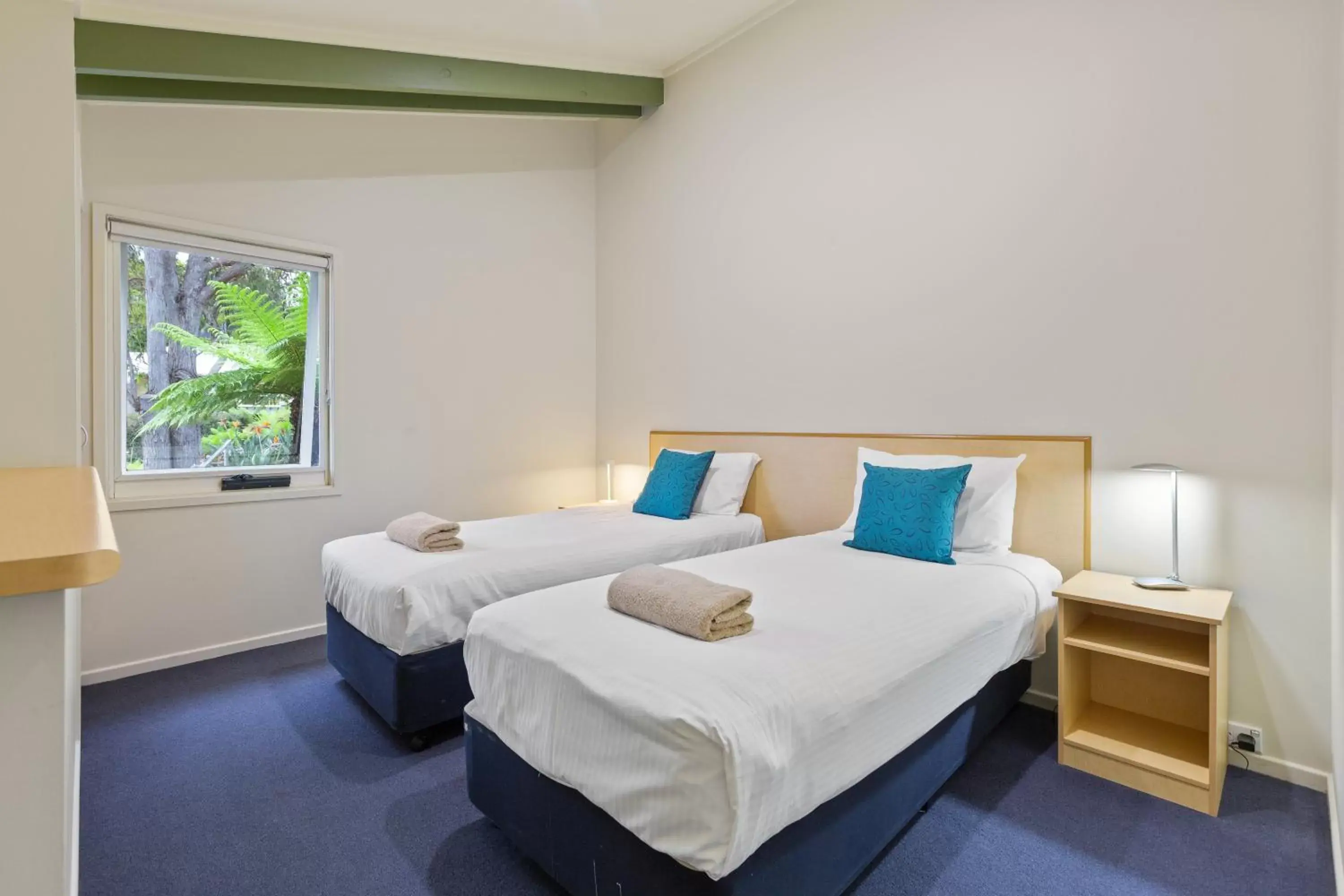 Bed in Tathra Beach House Holiday Apartments