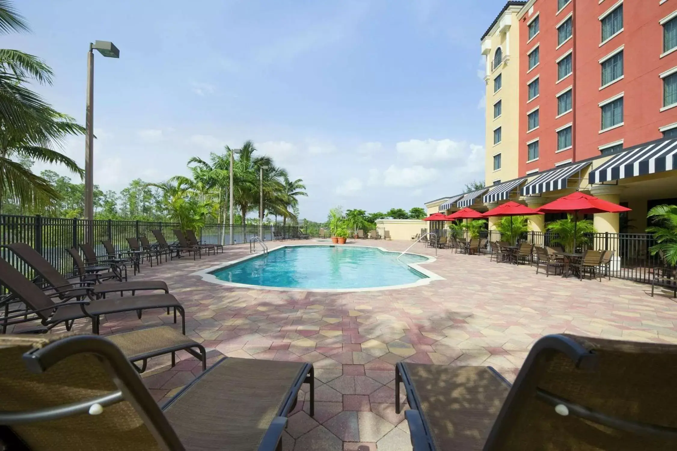 Property building, Swimming Pool in Embassy Suites Fort Myers - Estero