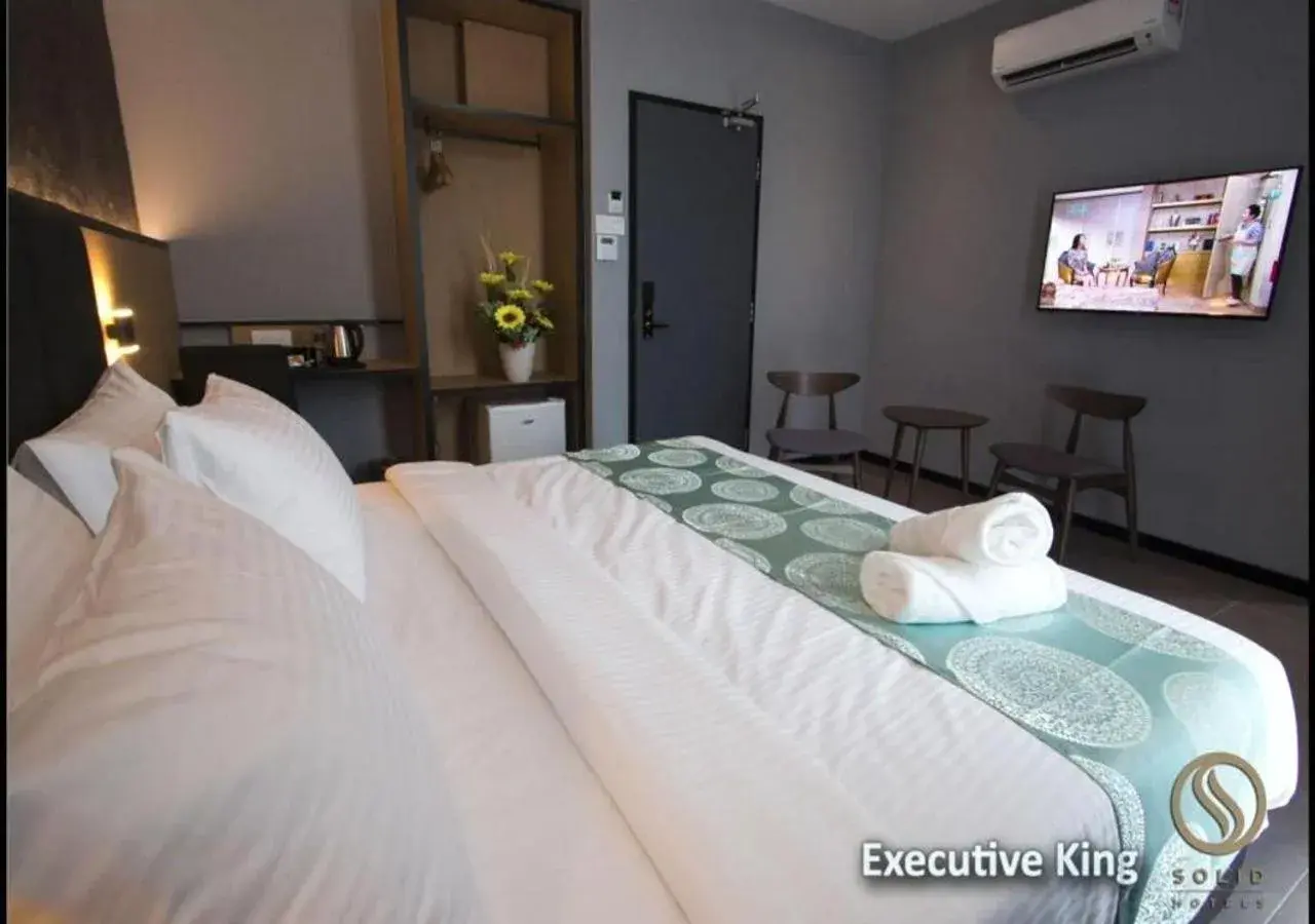 Bed in Solid Hotels