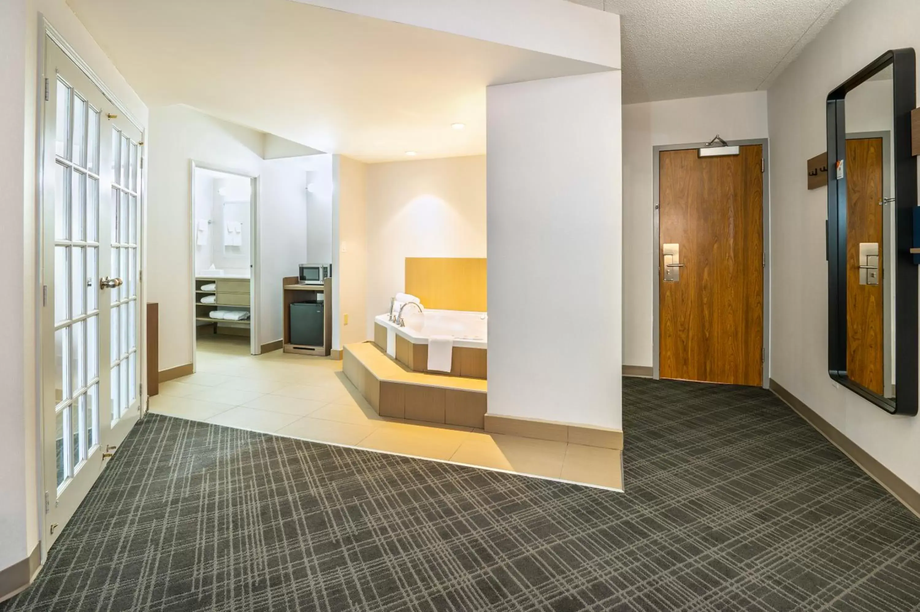 Bedroom, Seating Area in Comfort Inn & Suites Barrie