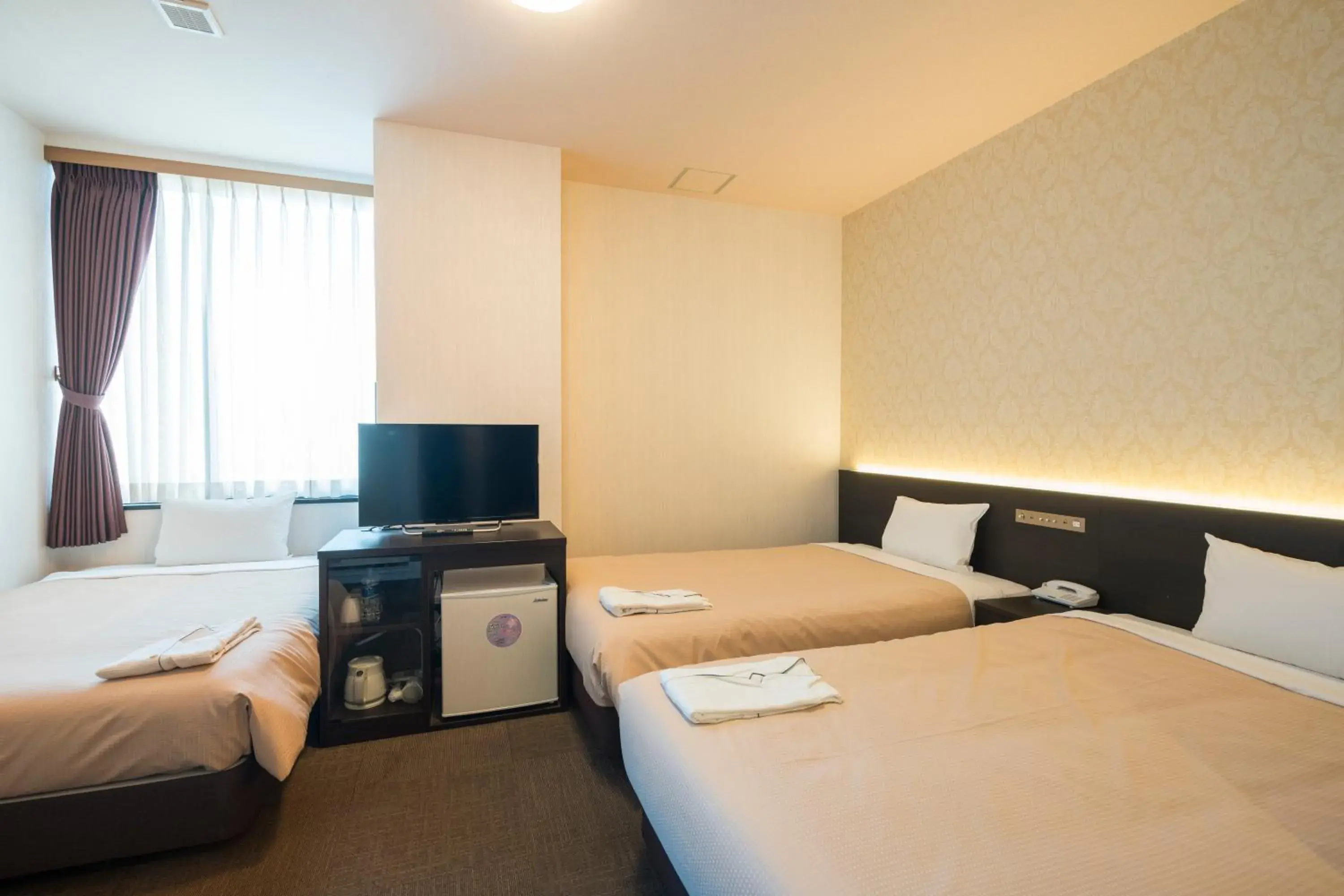 Photo of the whole room, Bed in Hotel Hakata Nakasu Inn