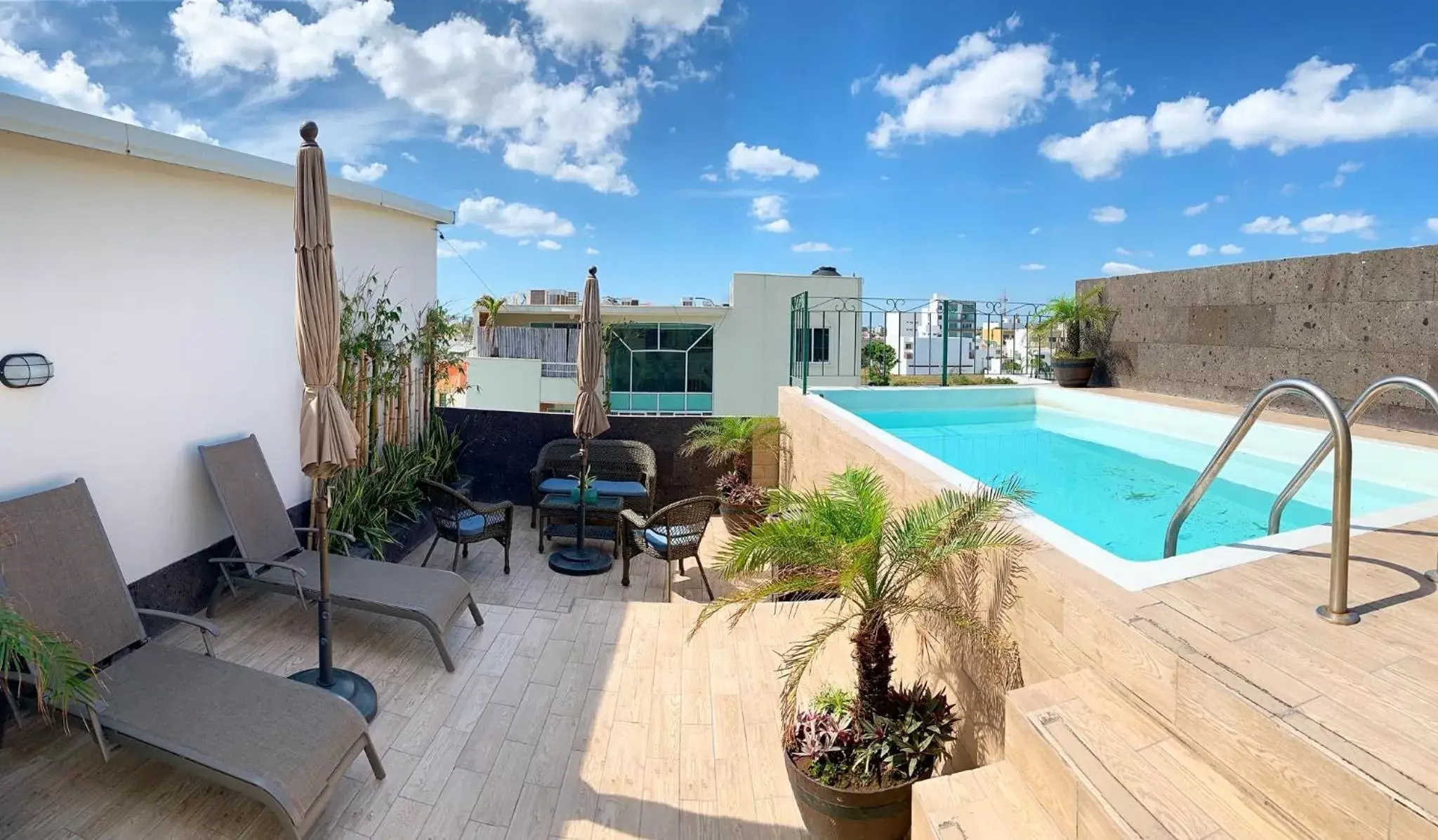 Balcony/Terrace, Swimming Pool in Boca Inn Hotel & Suites