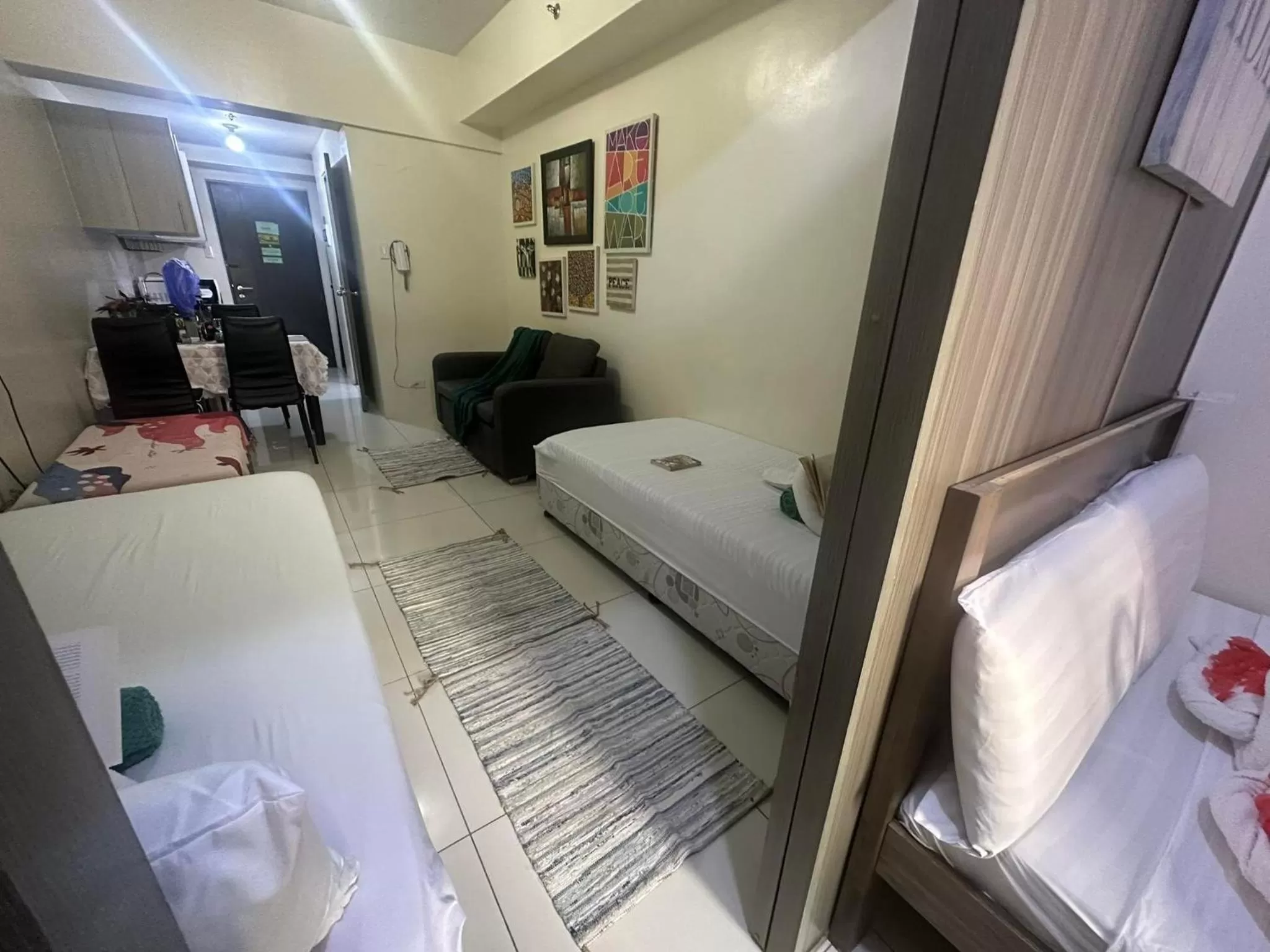 Bed in Green Residences Stays by PBYY