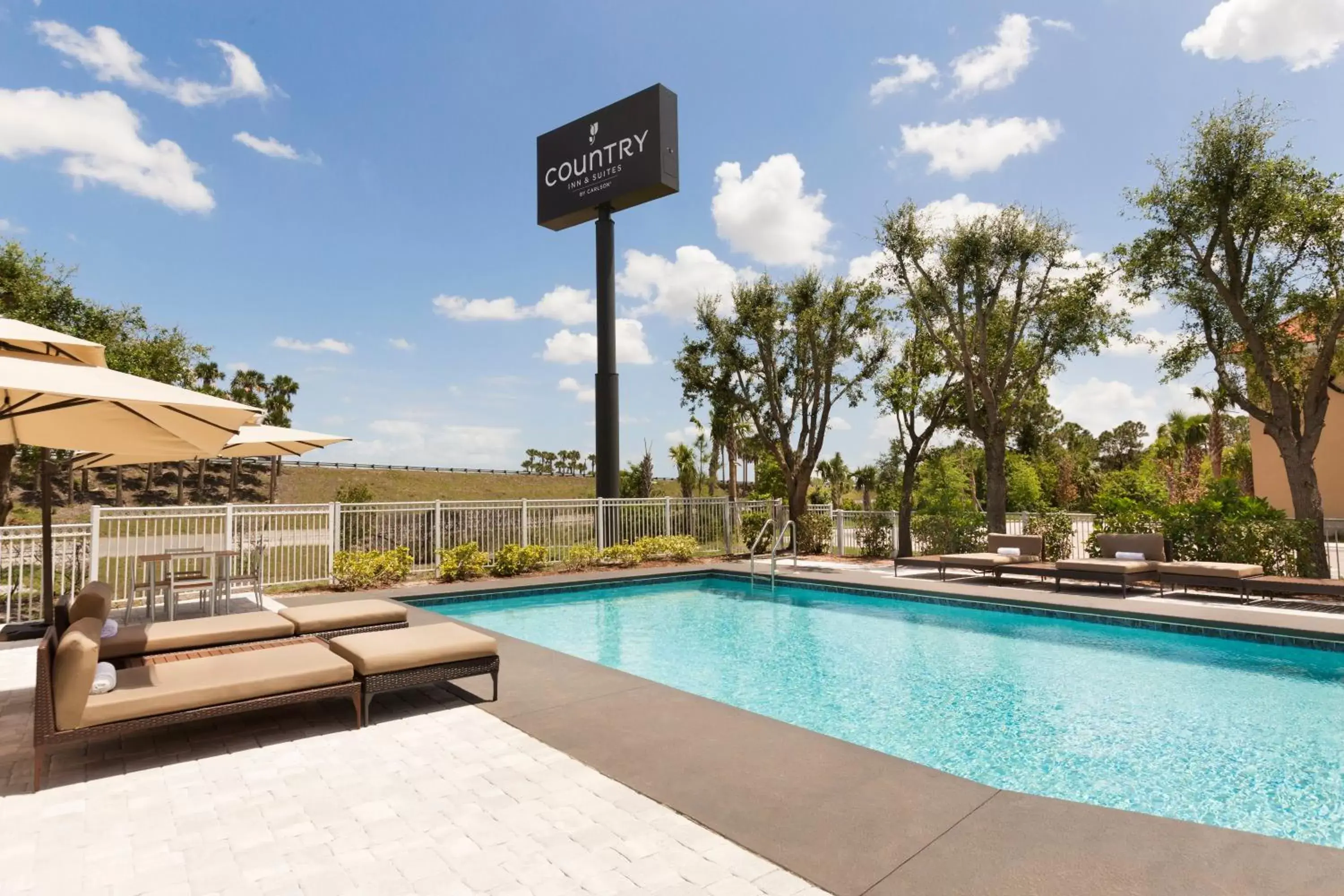 Balcony/Terrace, Swimming Pool in SureStay Plus Hotel by Best Western Vero Beach