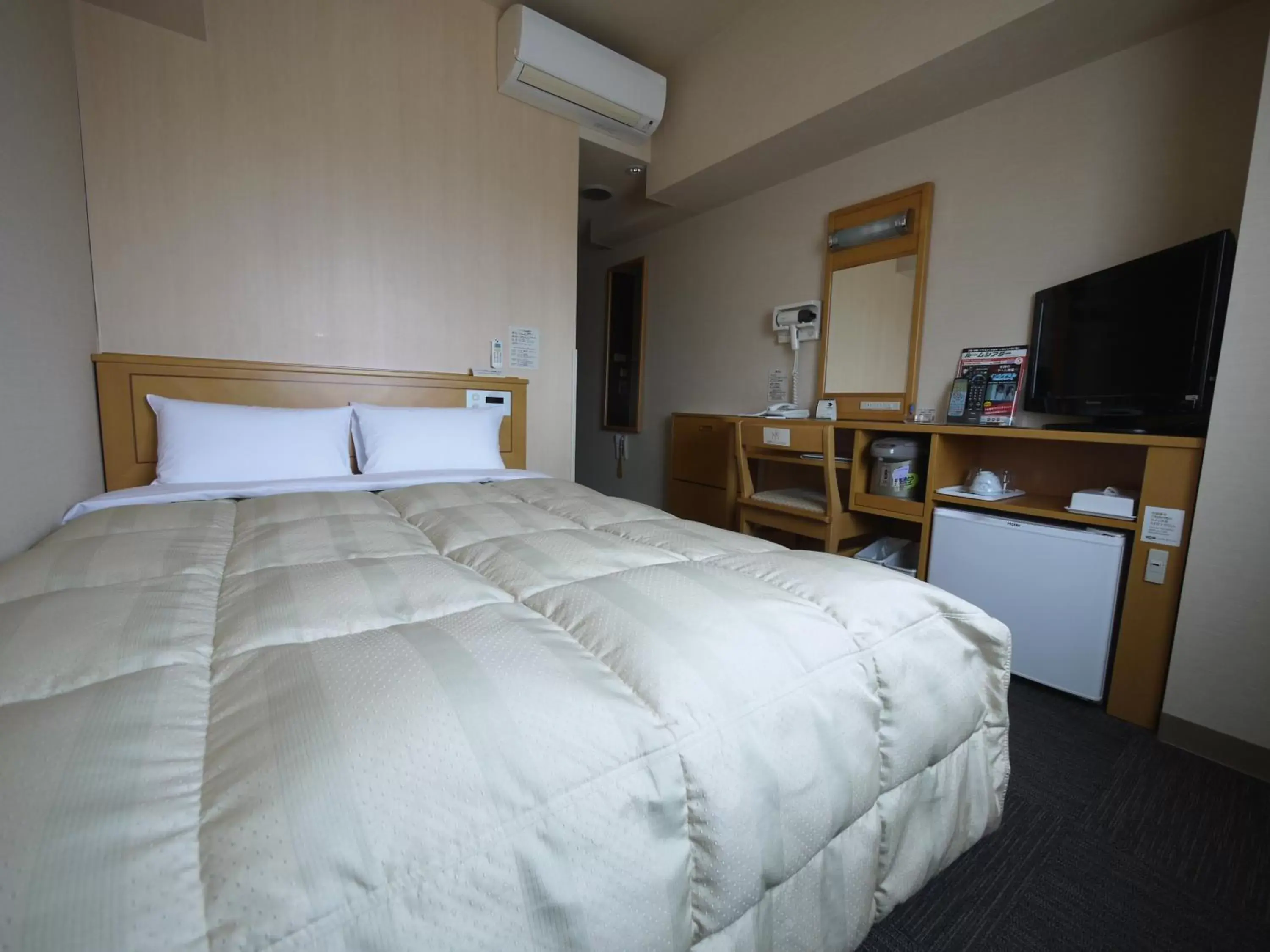 Bed in Hotel Route-Inn Sakata