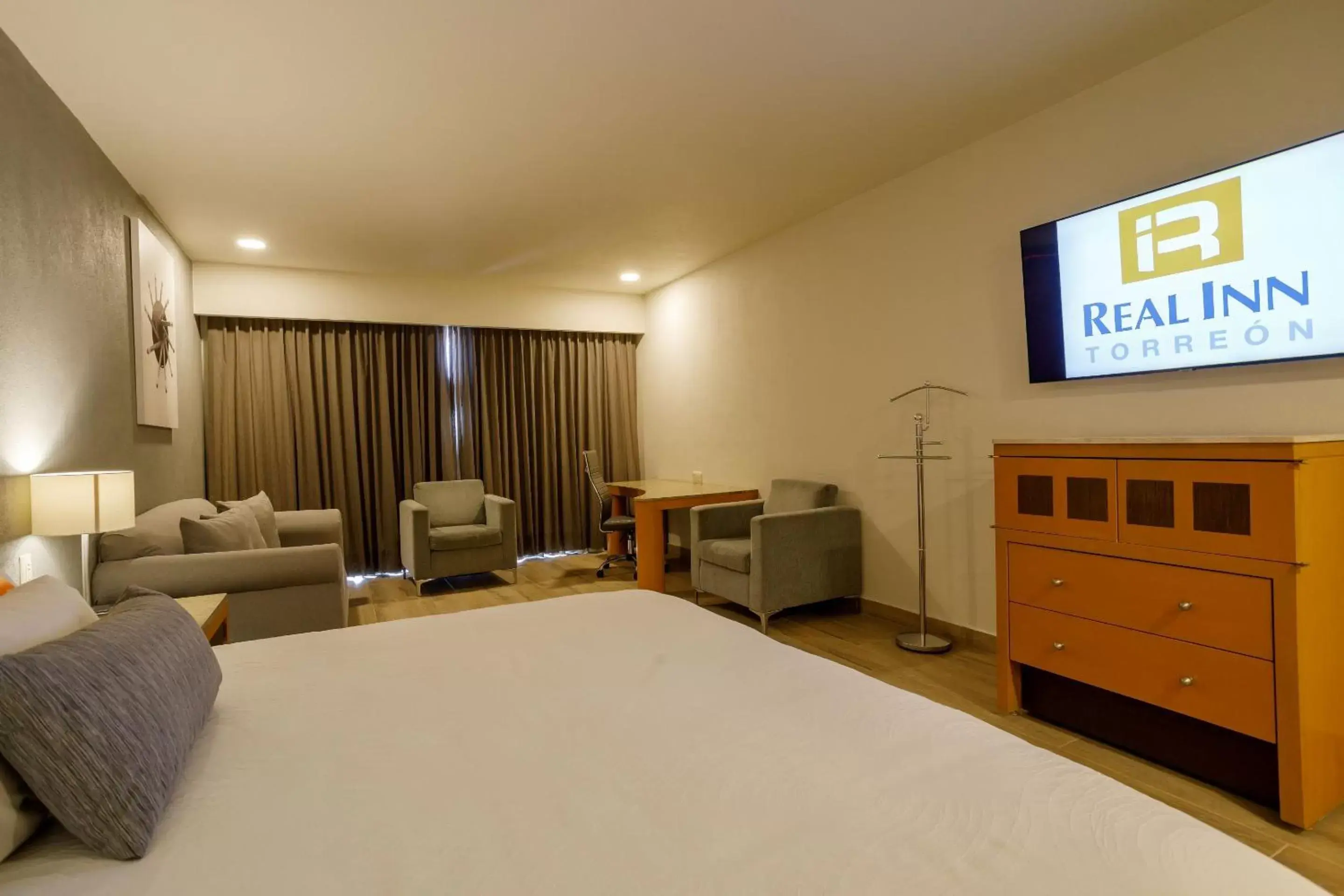 Photo of the whole room, TV/Entertainment Center in Real Inn Torreon